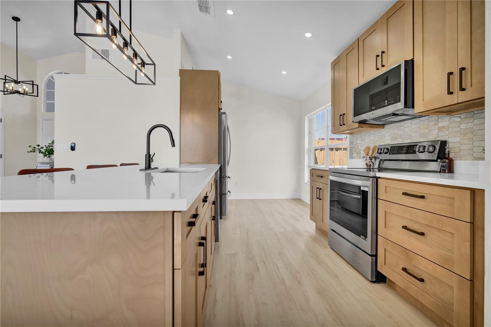 Chefs kitchen featuring LG appliances, modern shaker cabinets, calcatta quartz. - 8320 SOUTHERN FOREST DR, ORLANDO