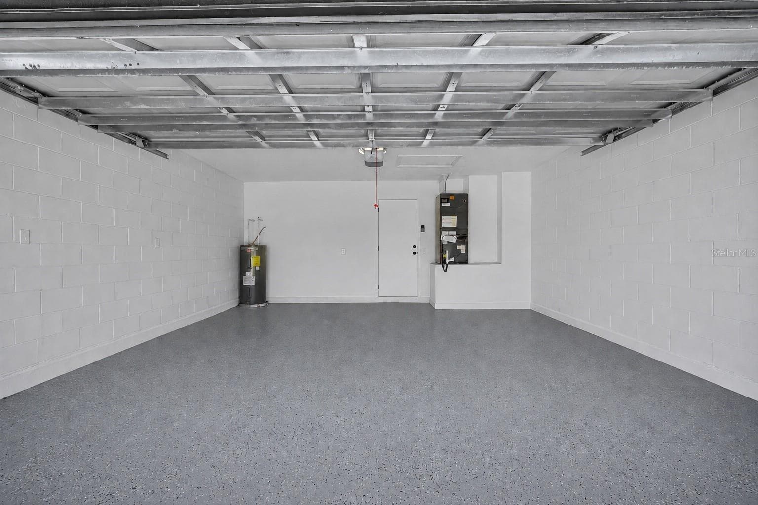Two car garage with fresh epoxy. - 8320 SOUTHERN FOREST DR, ORLANDO