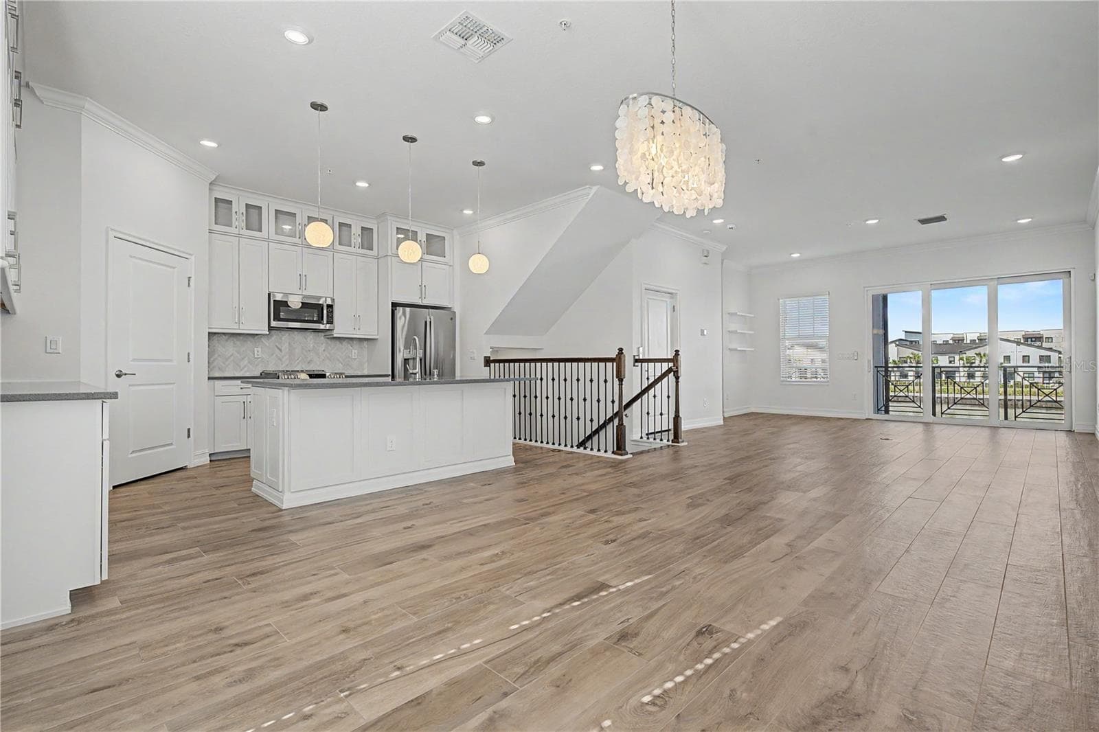 Second-level kitchen/dining  opening seamlessly to the living area. - 5351 BRIDGE ST #38, TAMPA