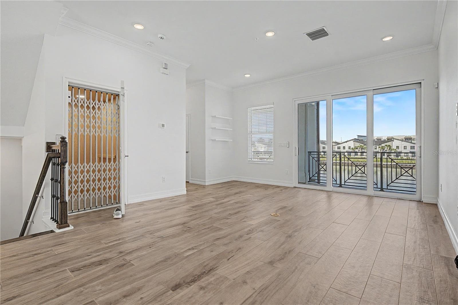 Second-level living area-elevator-doors to second floor balcony - 5351 BRIDGE ST #38, TAMPA