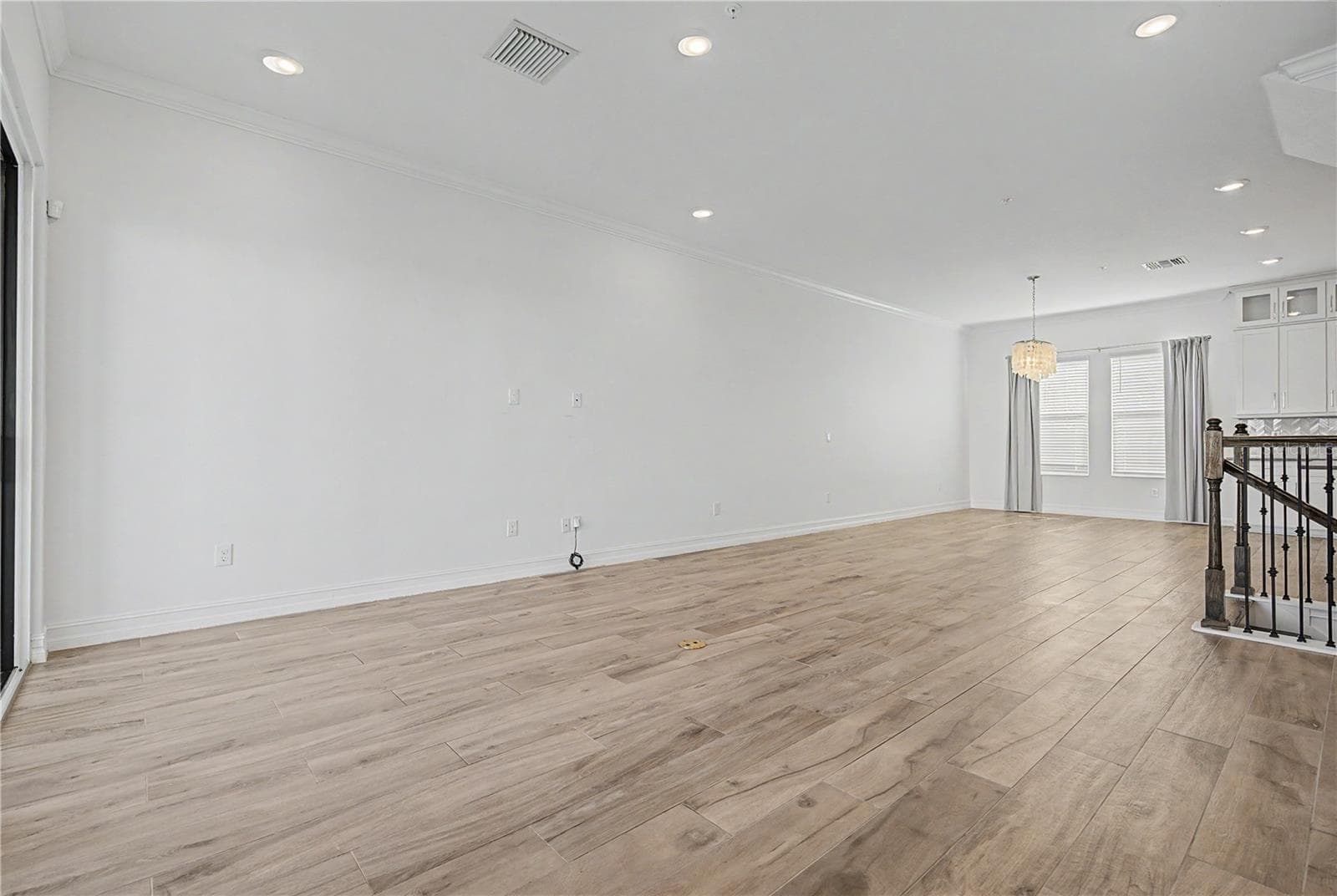 Second-level view from the living area, again highlighting the open-concept layout. - 5351 BRIDGE ST #38, TAMPA
