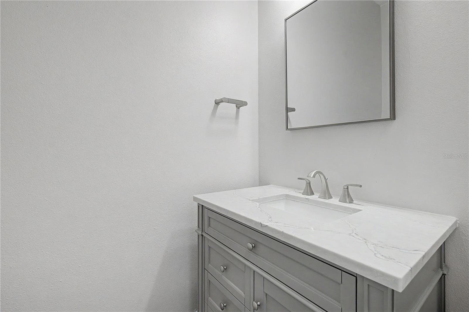 Second-level bathroom conveniently located in the hallway just off the living area, near the stairs leading to the third level. - 5351 BRIDGE ST #38, TAMPA
