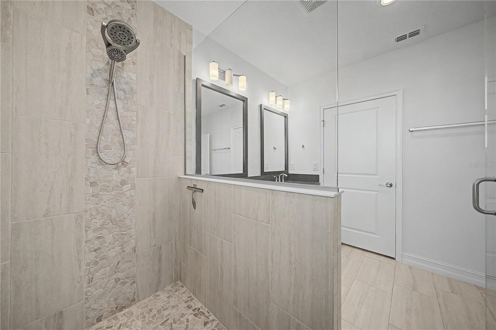 Third-level primary bathrooms beautifully designed, spacious walk-in shower - 5351 BRIDGE ST #38, TAMPA