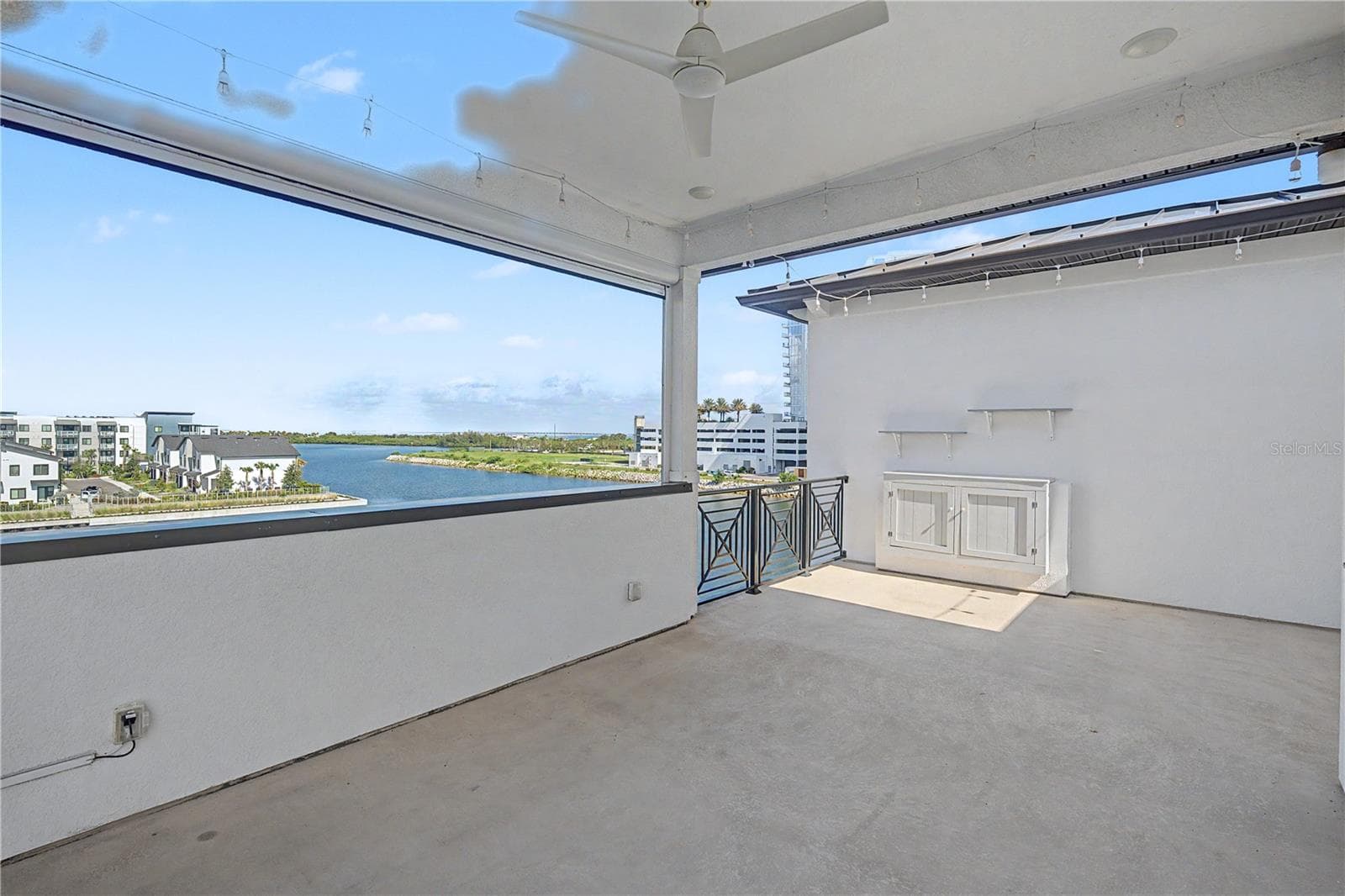 Fourth-level private patio offering a front-row seat for possible dolphin sightings. - 5351 BRIDGE ST #38, TAMPA
