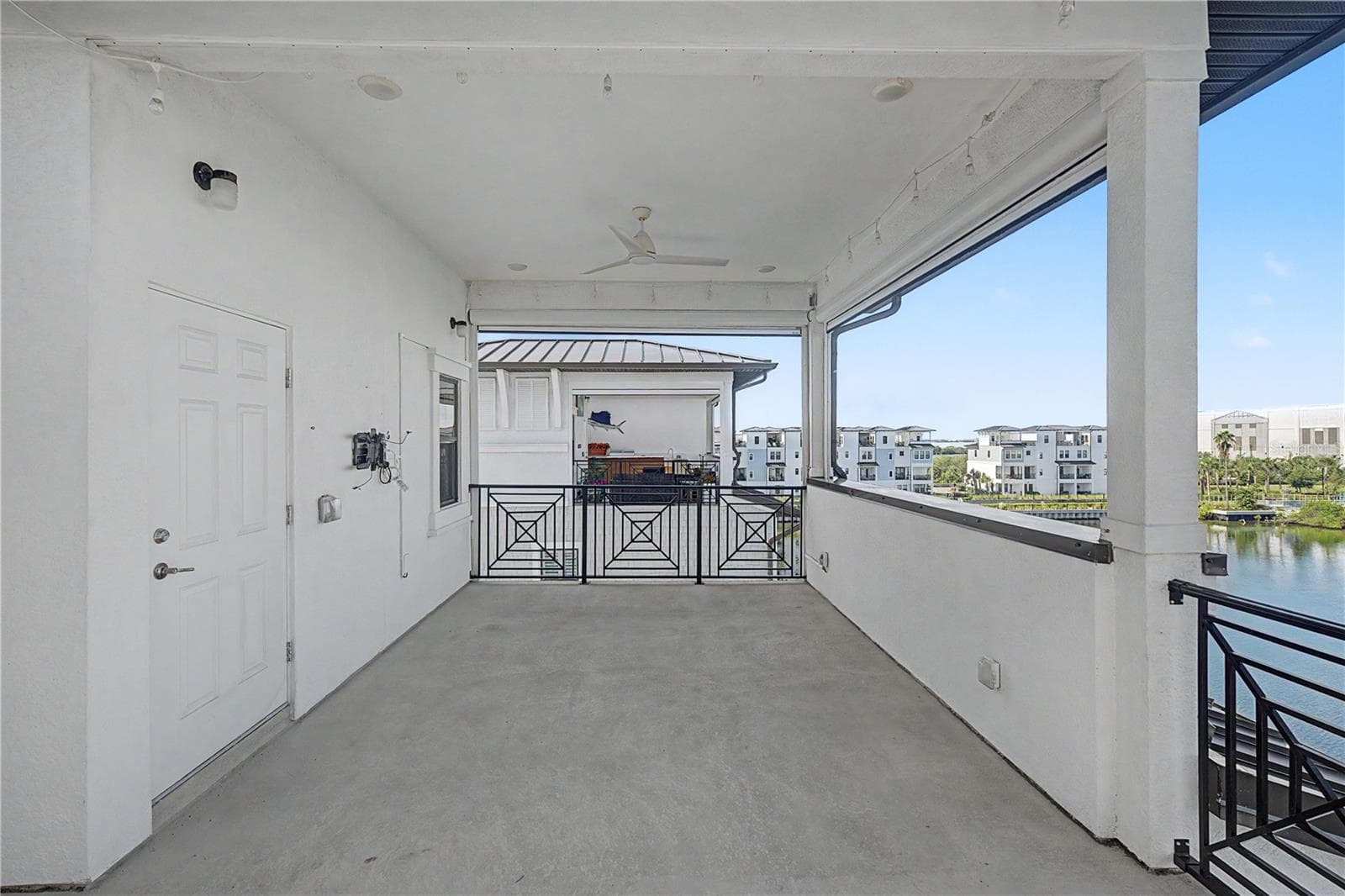 Fourth-level outdoor patio with large seating area. - 5351 BRIDGE ST #38, TAMPA