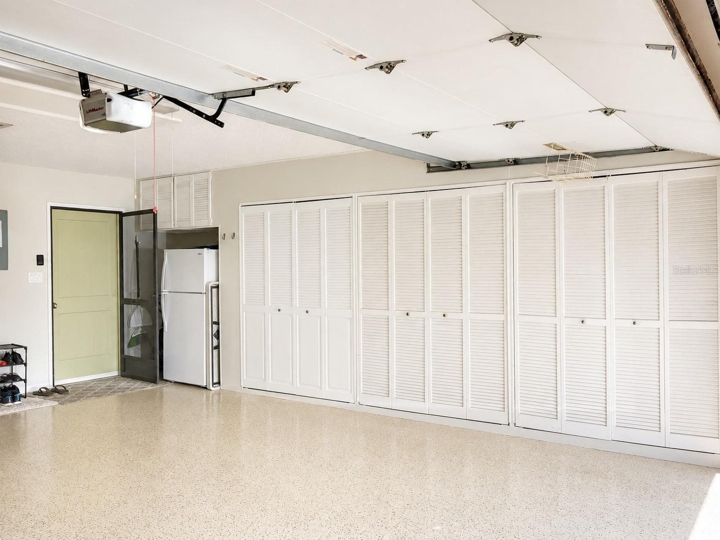 Garage: Wall-to-Wall Storage & Kitchen Entry - 100 S TREMAIN ST #G2, MOUNT DORA