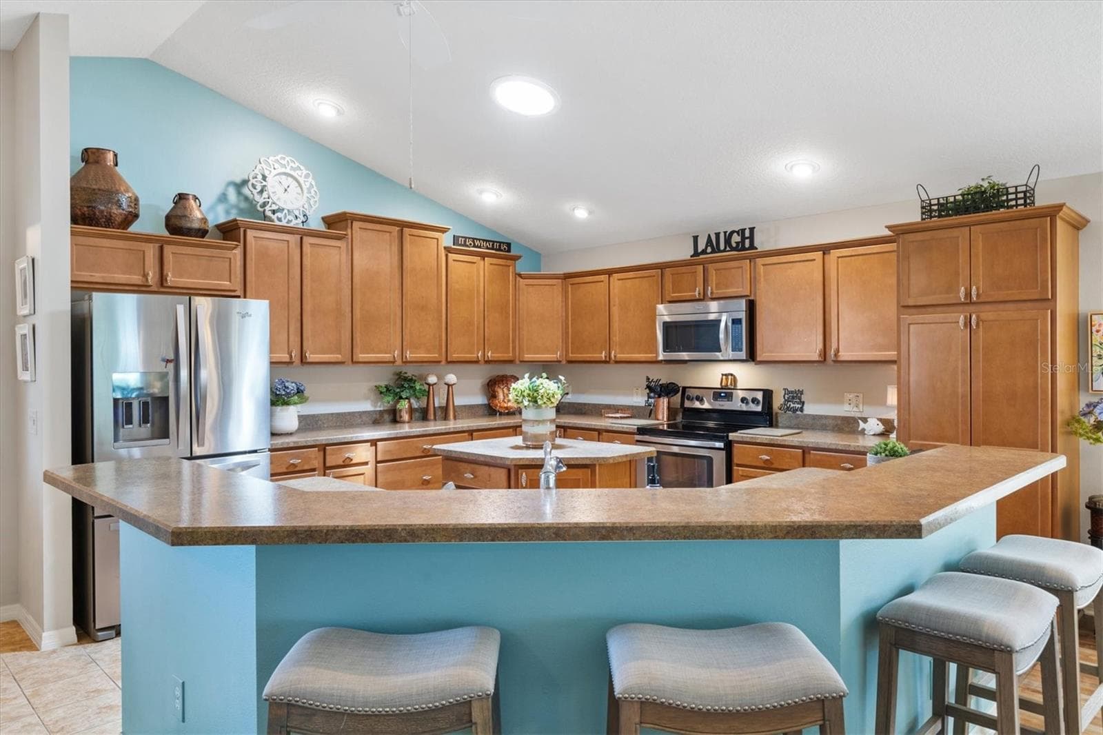 Open kitchen with pull out cabinet drawers for easy access. - 2334 ROSE ARBOR ST, THE VILLAGES