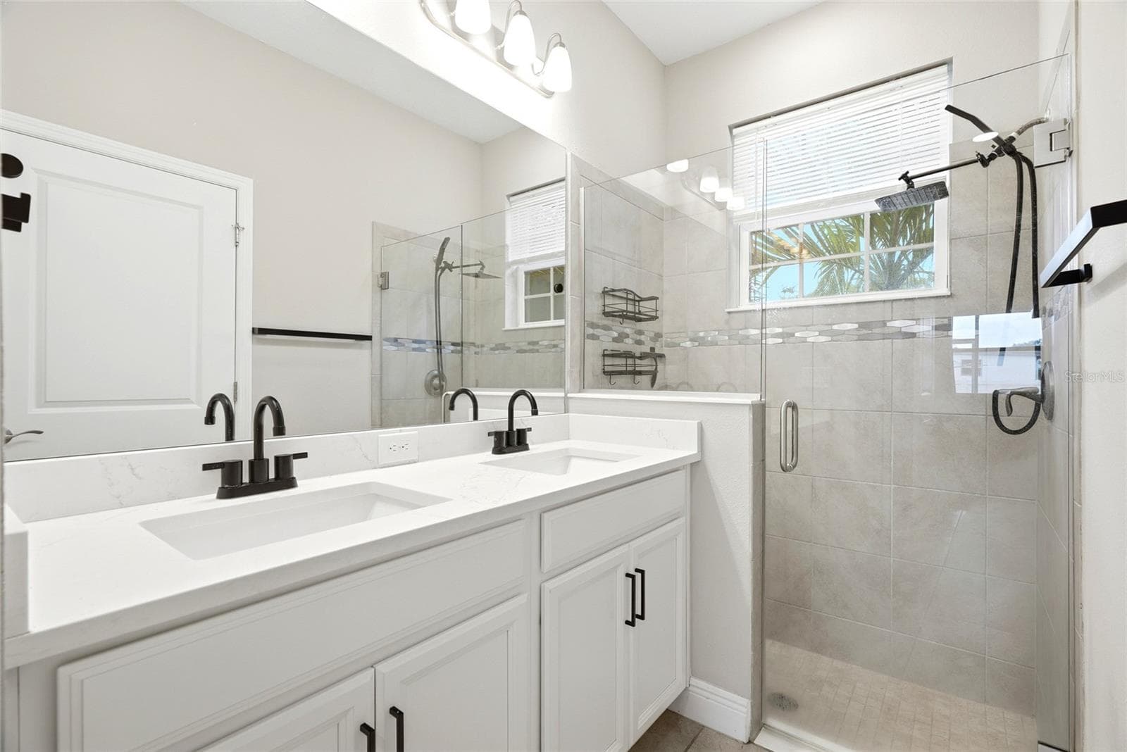 Primary ensuite with dual sink and walk-in shower - 5282 NEIL DR, ST PETERSBURG