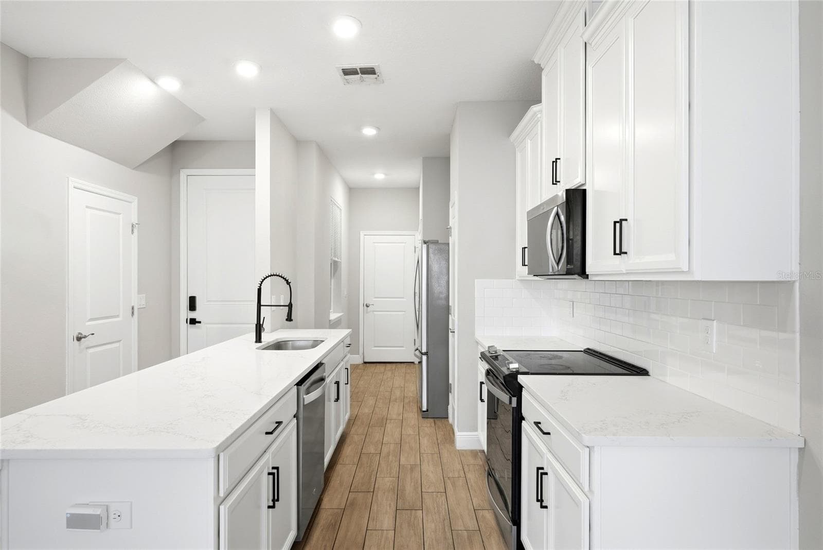 Kitchen area with access to the garage - 5282 NEIL DR, ST PETERSBURG