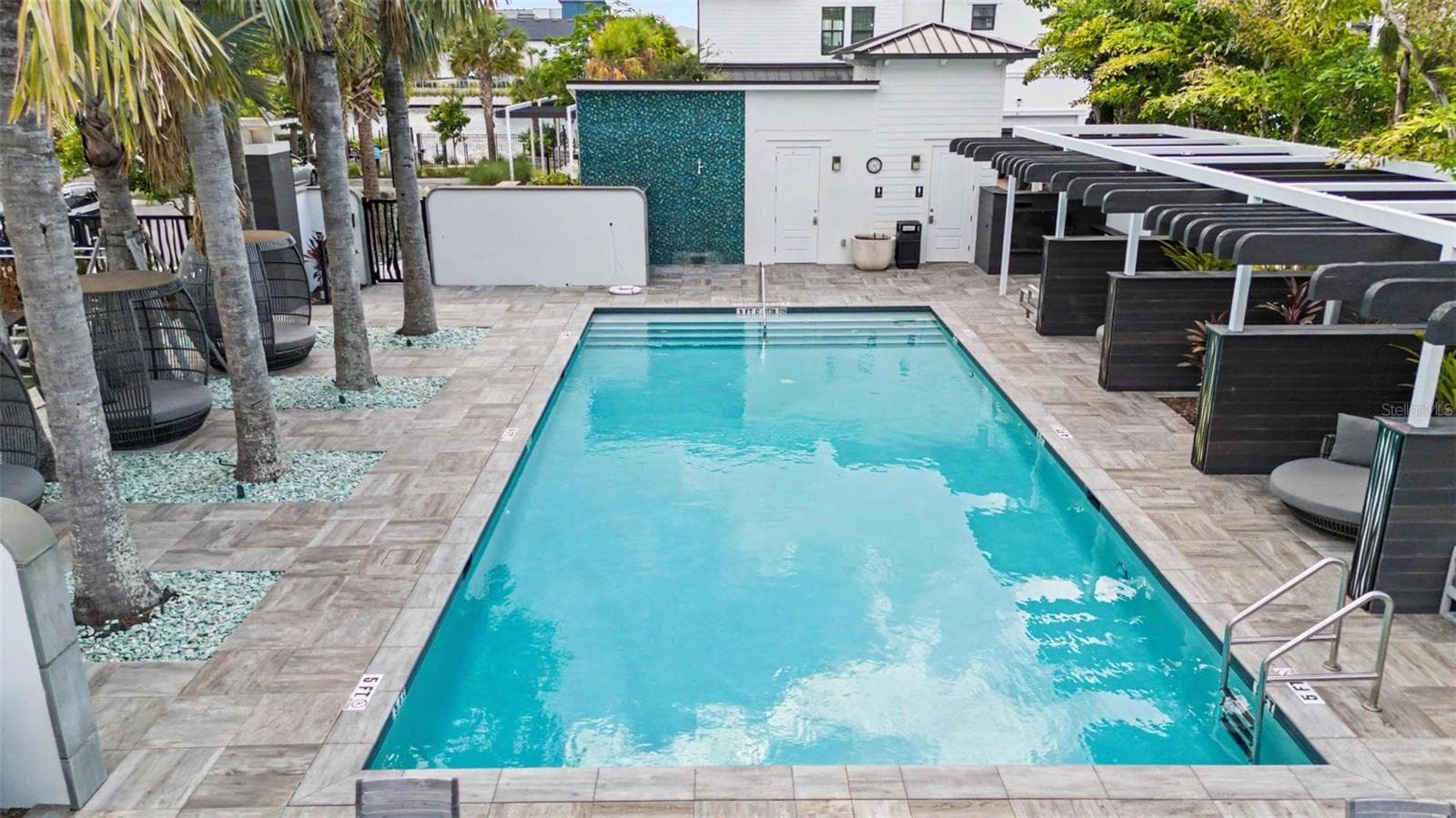 Inviting community pool, perfect for relaxing and unwinding in your downtime. - 5351 BRIDGE ST #38, TAMPA