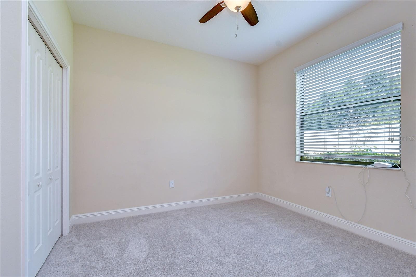 Secondary bedrooms offer versatility for guests, home office, hobbies, or additional living needs - 826 VINO VERDE CIR, BRANDON