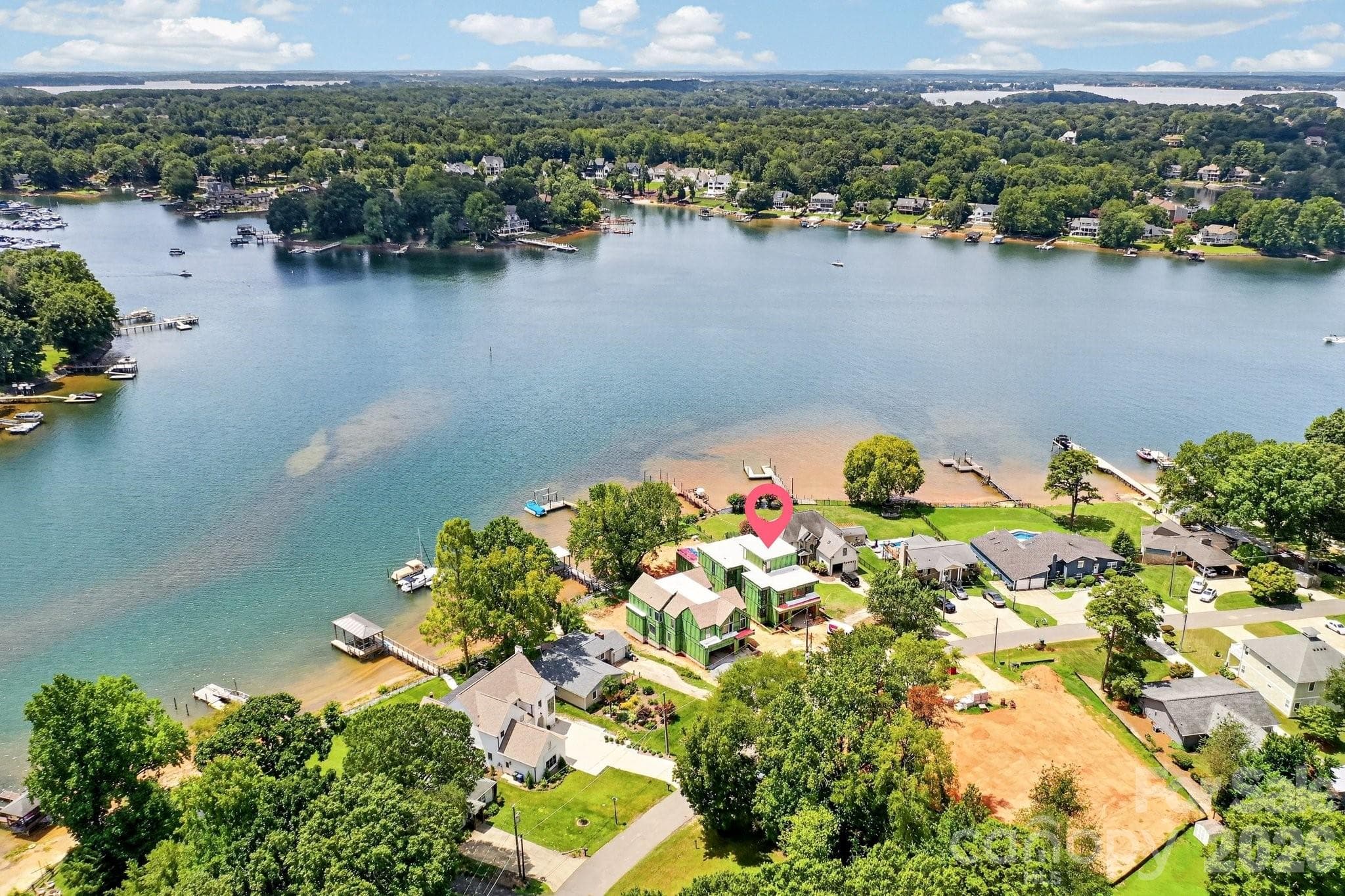 Another aerial view of the homes positioning on the lake.  At the end of the pier is plenty of water for your boat. - Cornelius