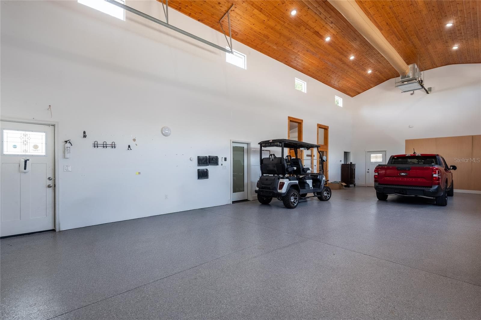 RV Garage with entry doors to the 2 car garage and the cottage - 6757 AMANDA VISTA CIR, LAND O LAKES