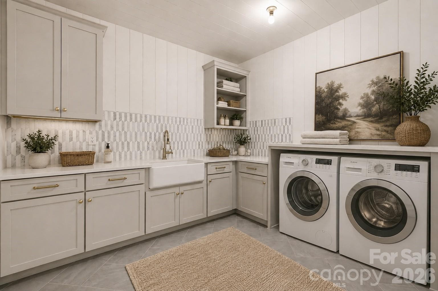 UPSTAIRS Dedicated secondary laundry room with cabinetry, sink and generous workspace.- Select imagery has been thoughtfully enhanced to help communicate the architectural vision, lifestyle potential, and intended design experience of the home - 125 Randstone Court, Charlotte