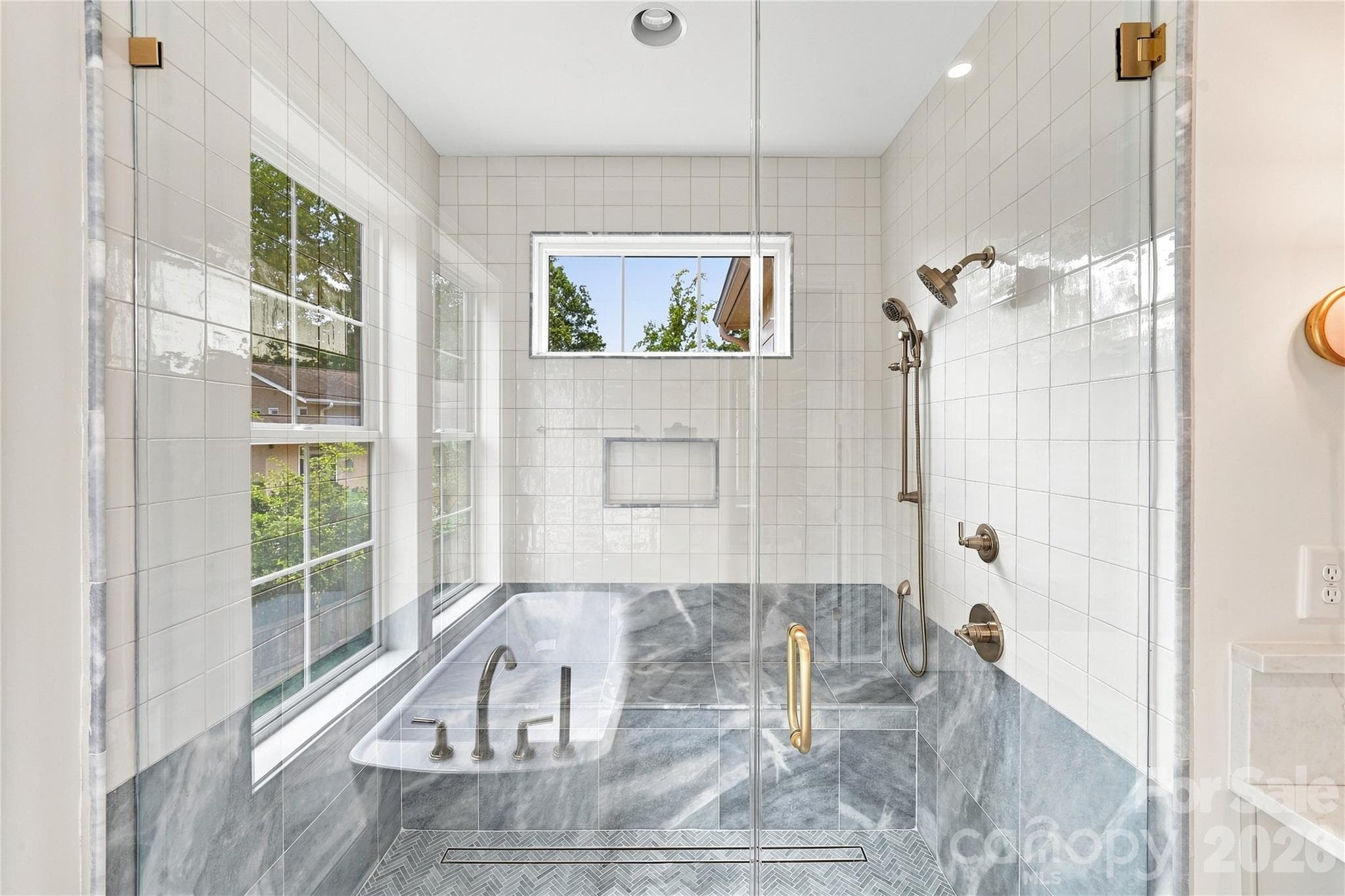 Primary Oversized marble shower with bench and multiple shower fixtures. - 125 Randstone Court, Charlotte