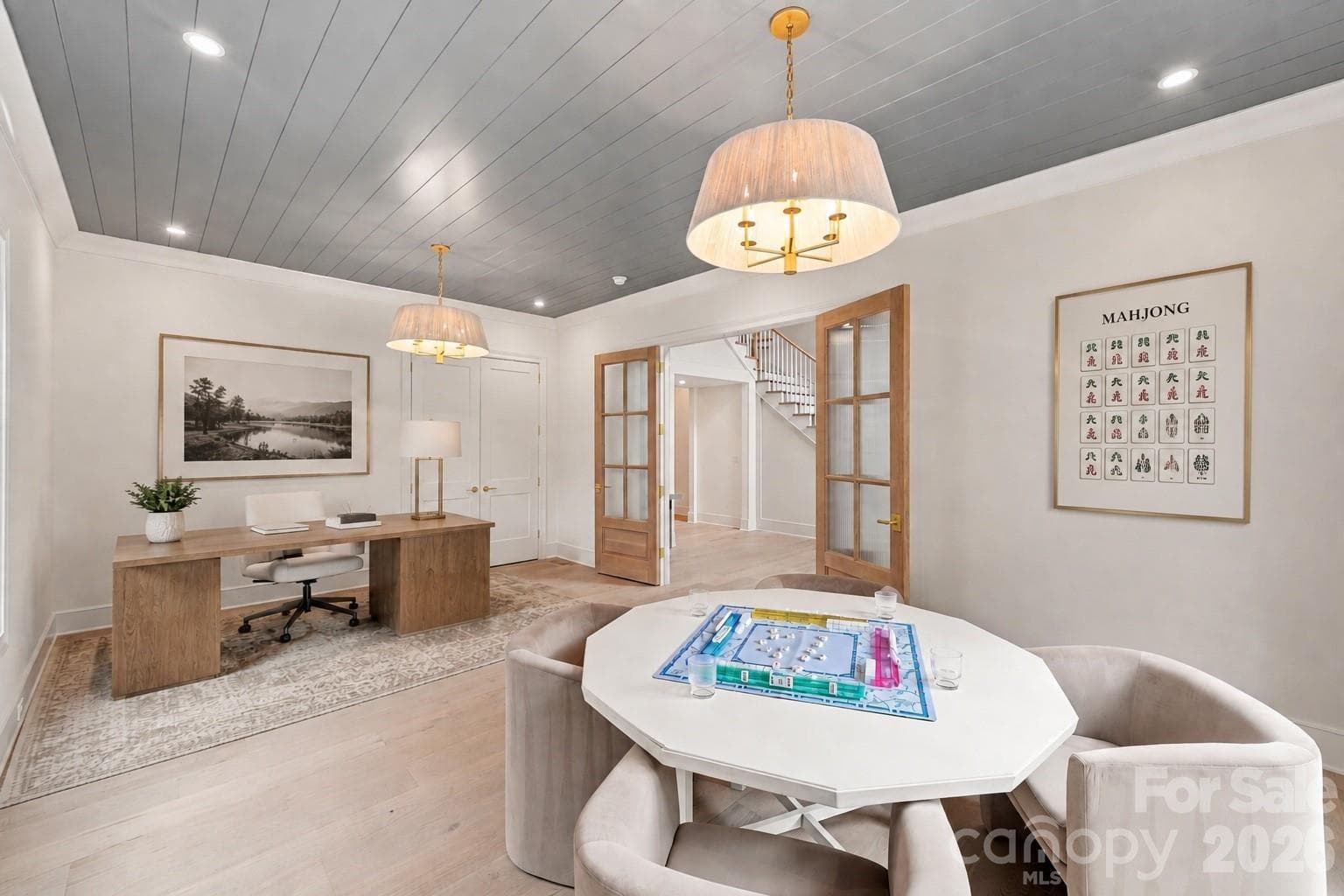 Custom wood French doors open from the foyer to a generously sized flex space, A versatile main-level space designed for an office, lounge, playroom or additional entertaining - 125 Randstone Court, Charlotte