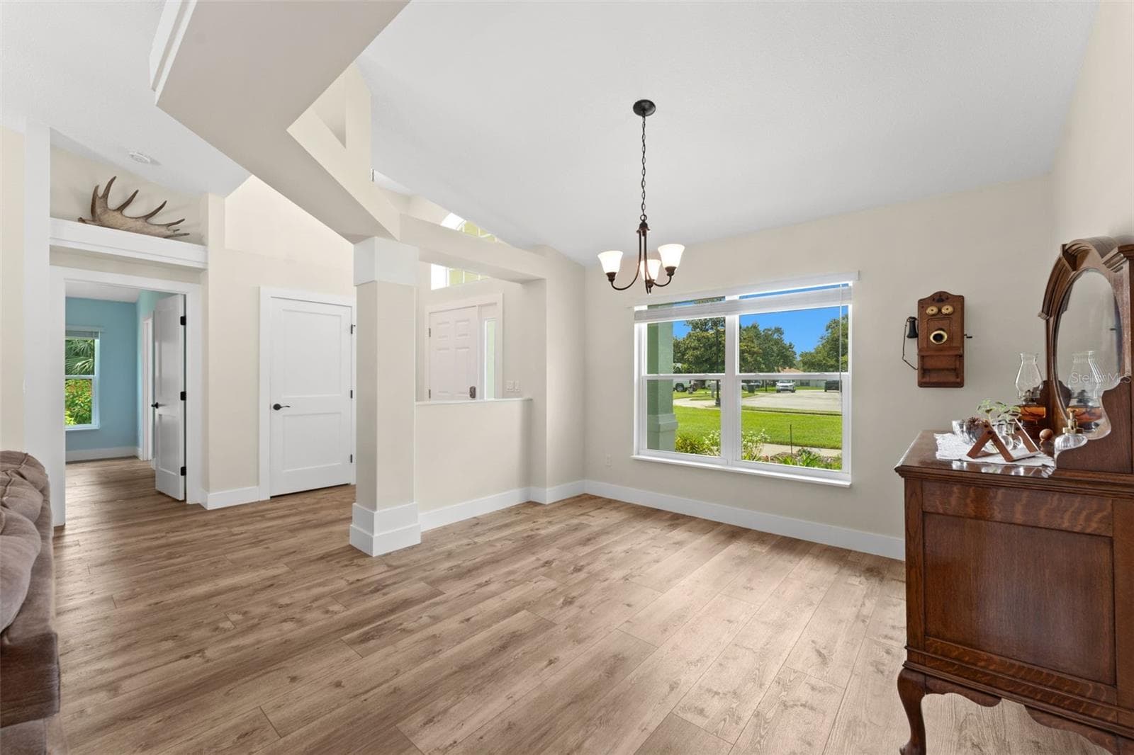 Views of dining room, foyer and entry to primary wing. - 846 MARLEY DR, PORT ORANGE