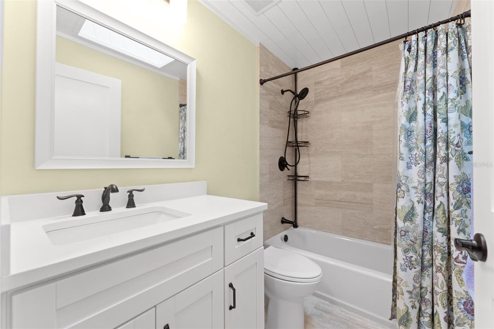Guest Bathroom... Shiplap and Skylight ceiling details - 846 MARLEY DR, PORT ORANGE