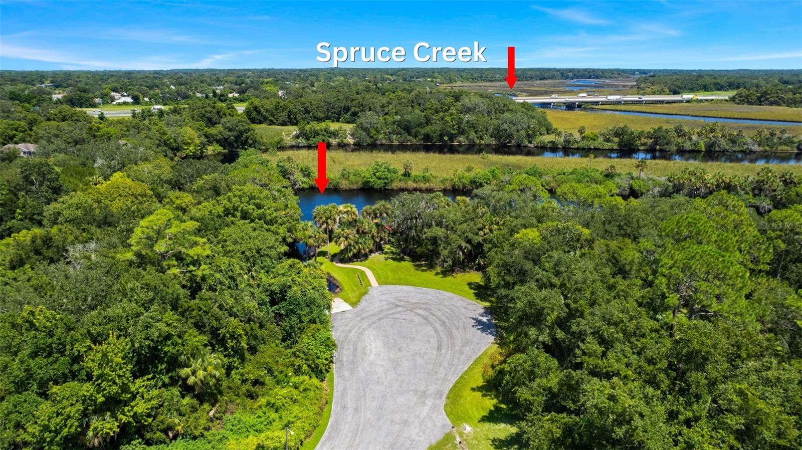 View to the south over boat ramp/dock area and Spruce Creek. - 846 MARLEY DR, PORT ORANGE