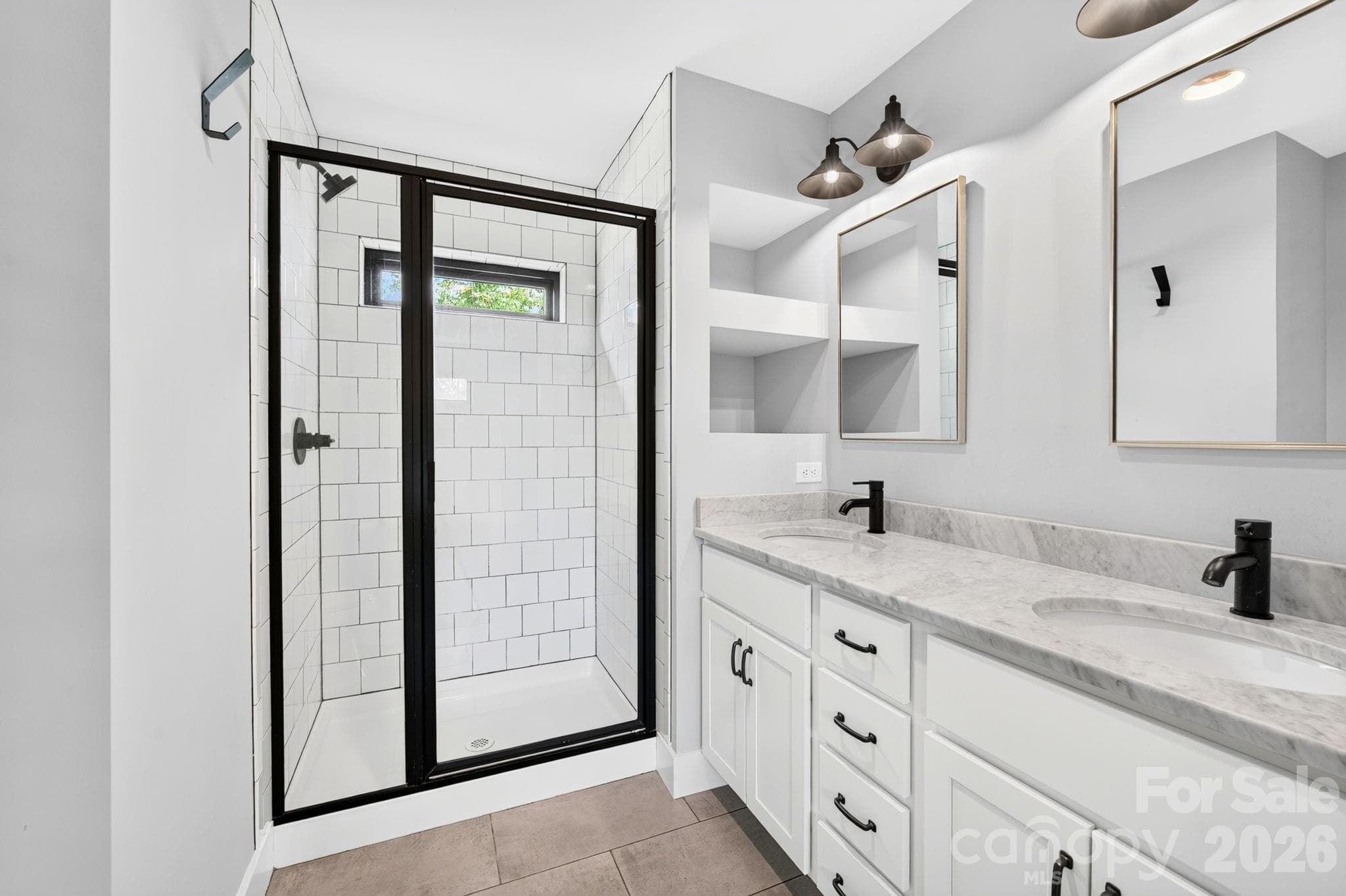 Luxurious bathroom featuring quality finishes, elegant stone counters, and water-efficient fixtures designed for lasting performance and sustainable design. - 613 Salem Heights Lane, Swannanoa