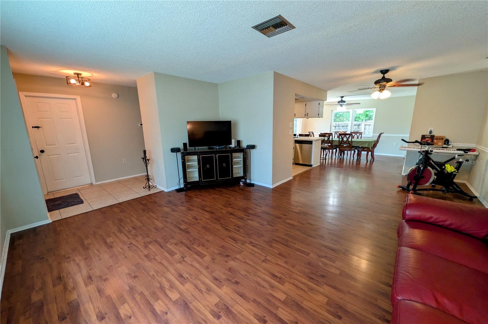 Living Room Looking into Kitchen Area and Dining - 11608 FOX RUN, PORT RICHEY
