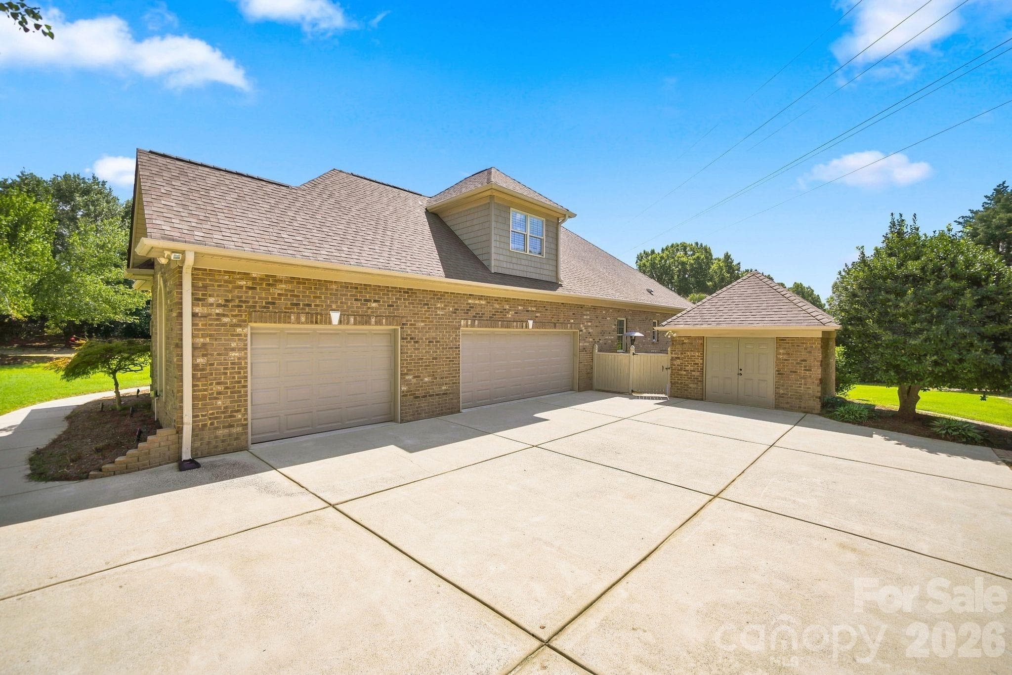 Oversized 3-car garage with built-in storage. - 1001 Heritage Acres Drive, Weddington