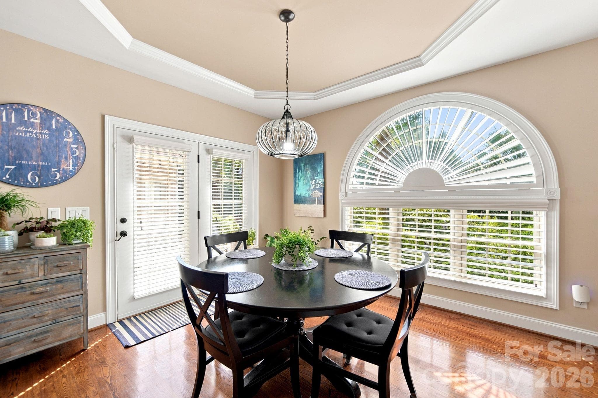Custom windows and blinds transform the room by bringing in natural light, making it feel bright and inviting. Enjoy the perfect combination of style and comfort! - 1001 Heritage Acres Drive, Weddington