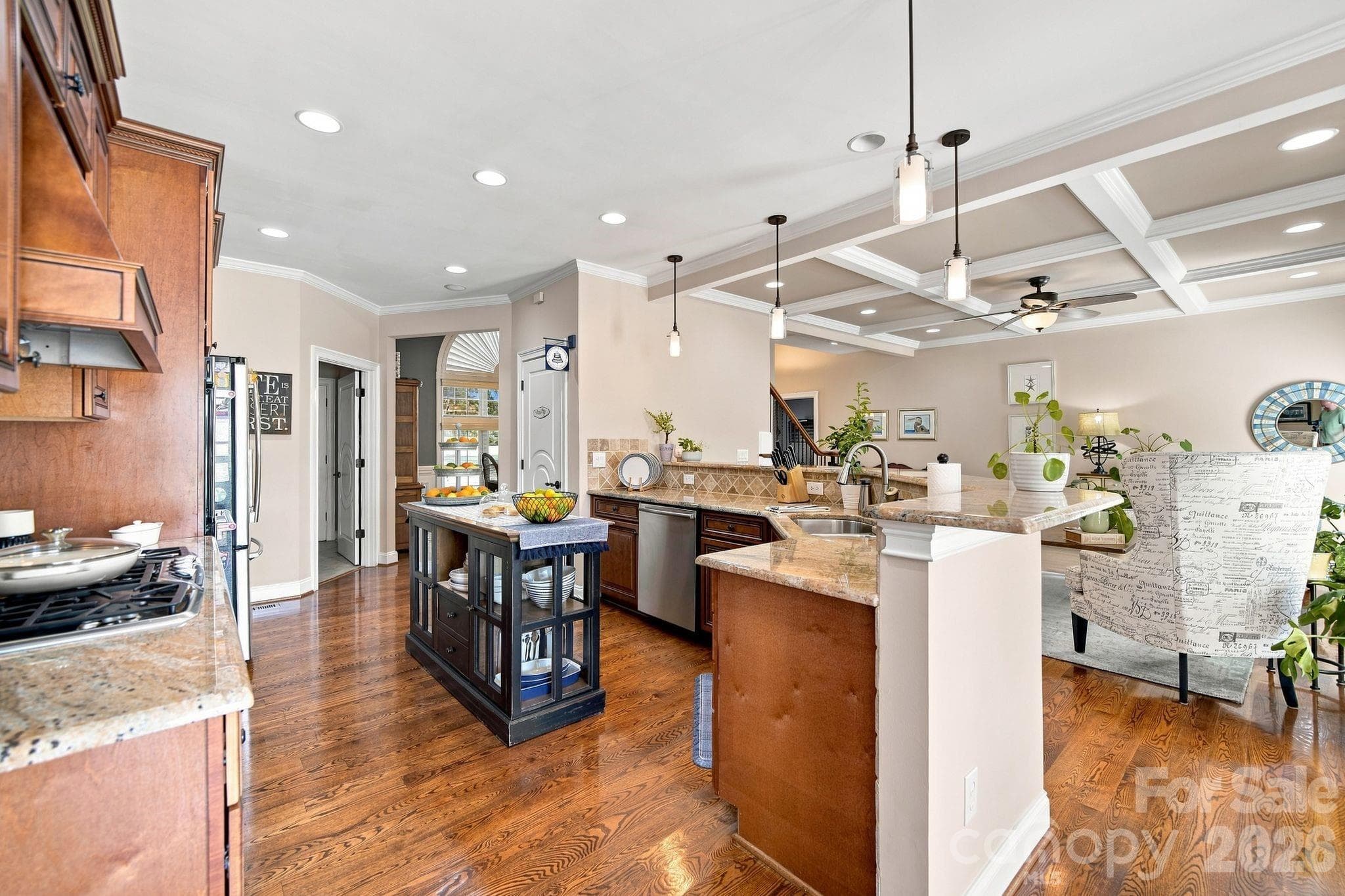 With double ovens, a 5-burner gas cooktop, and generous counter space, this kitchen is a dream come true for any chef. - 1001 Heritage Acres Drive, Weddington