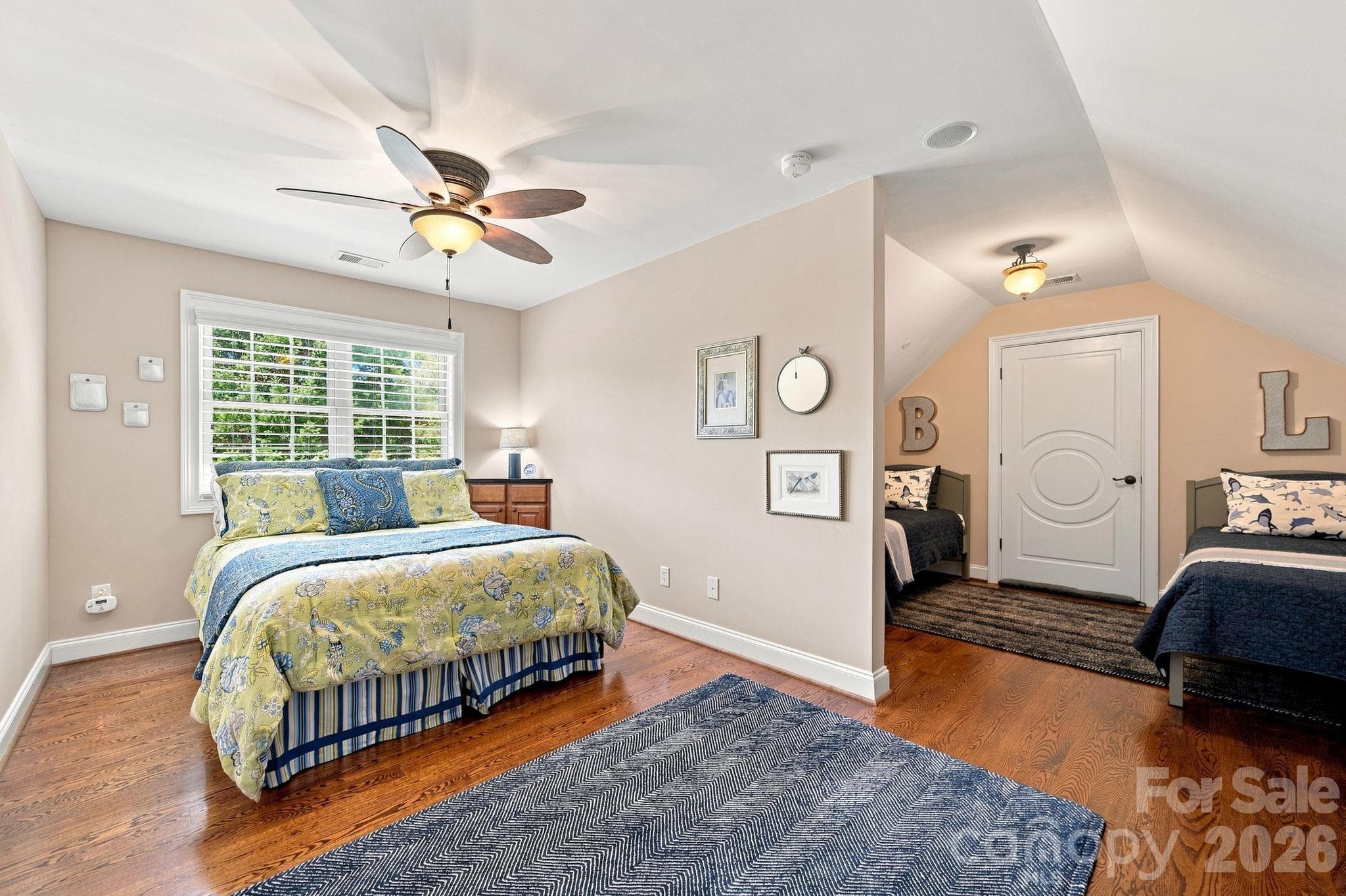 Another upstairs room is currently set up as a guest room, but it offers excellent potential as a home office, providing a quiet and productive space. - 1001 Heritage Acres Drive, Weddington