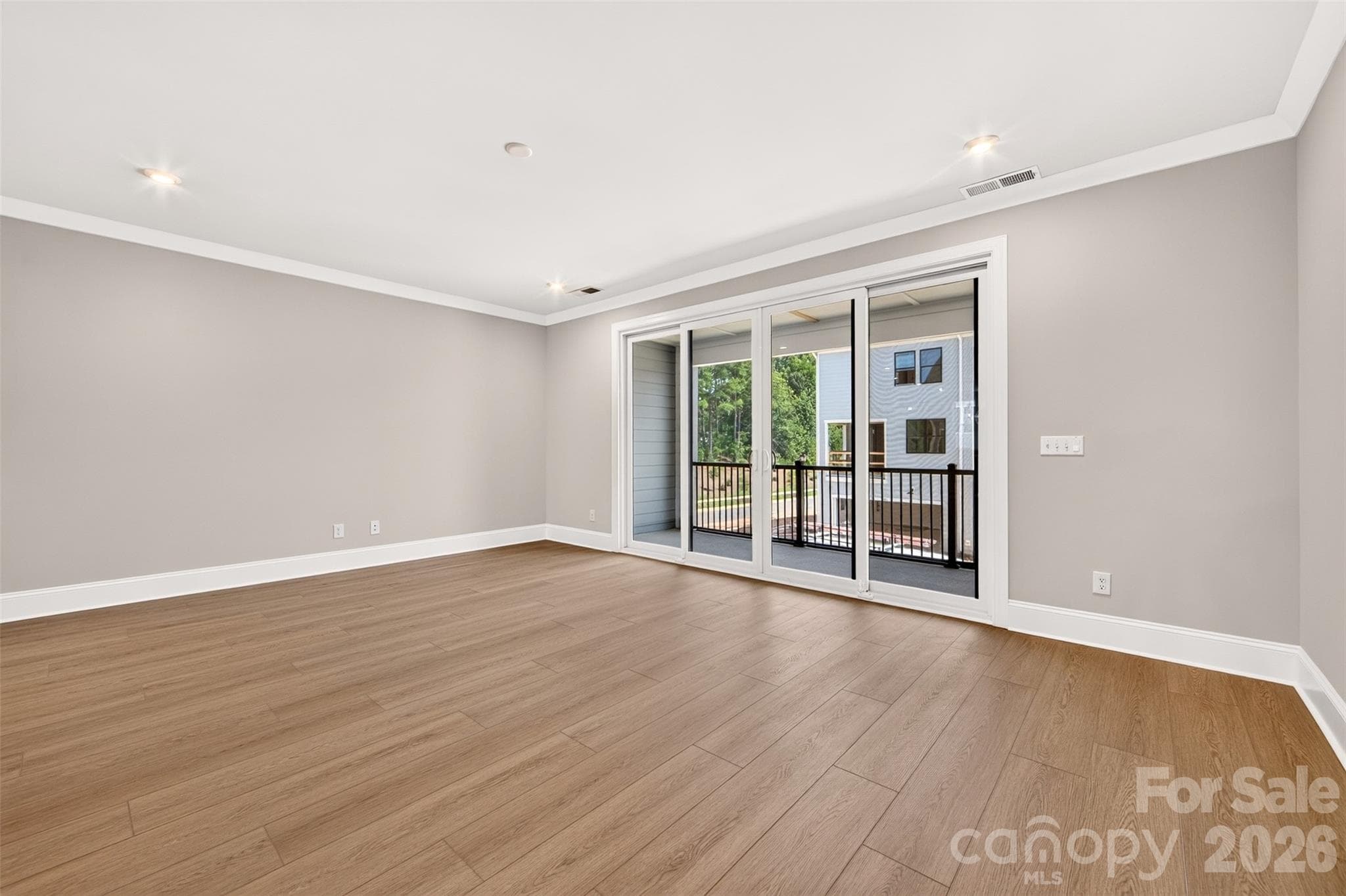 Living room with access to the covered outdoor living - 6008 Yellow Buckeye Drive, Charlotte