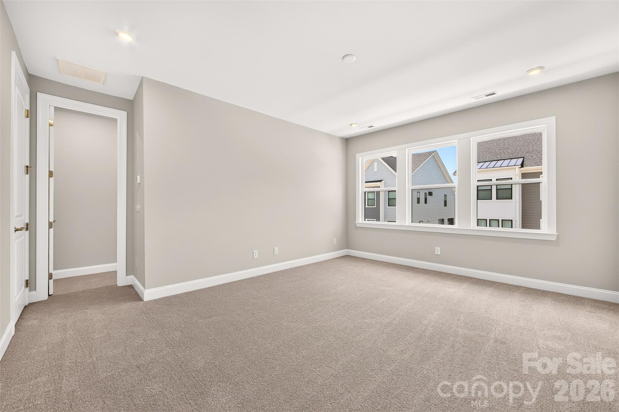 Light filled primary bedroom - 6008 Yellow Buckeye Drive, Charlotte