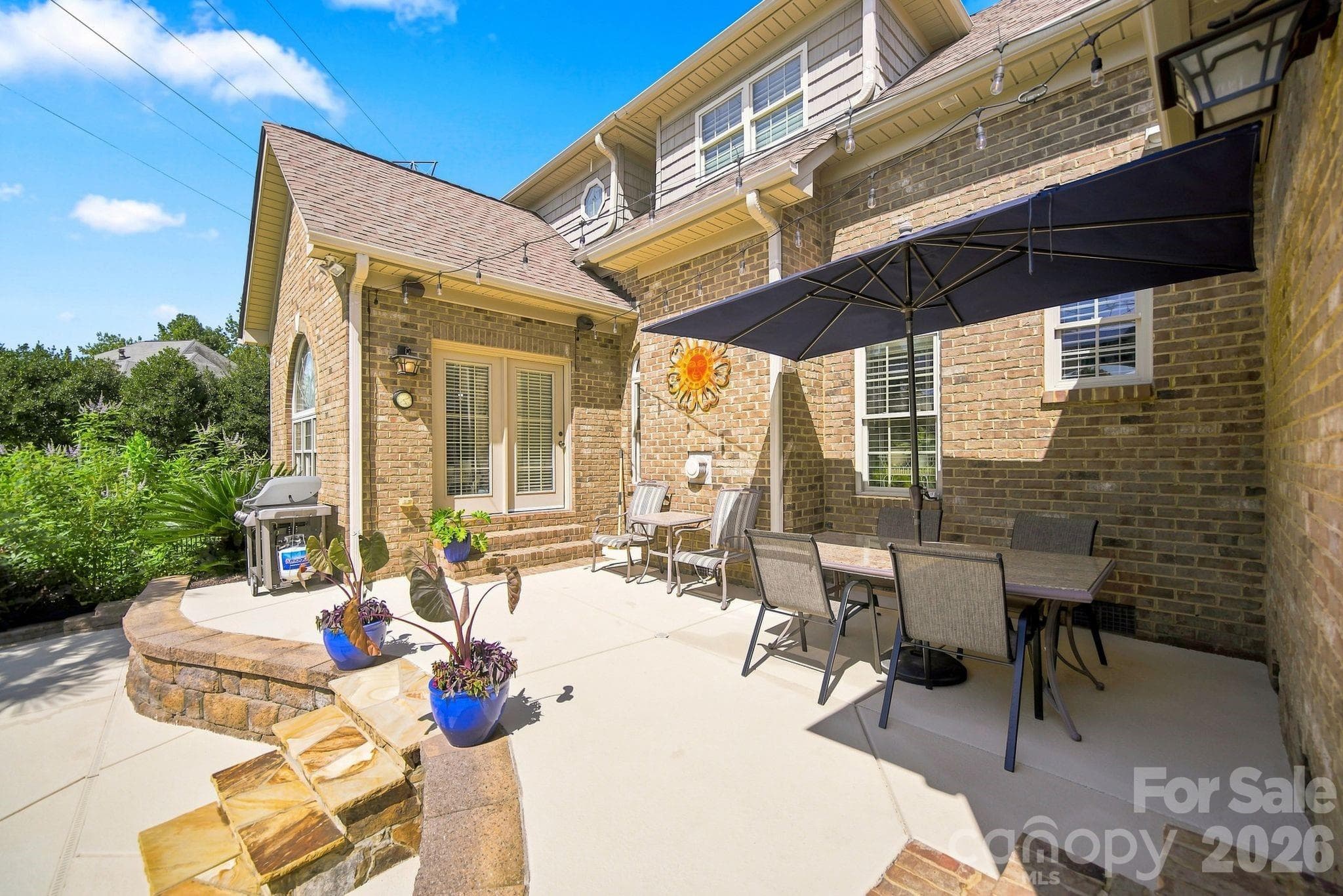 Enjoy the upper level of the pool area, an ideal spot for grilling, dining and getting some shade. - 1001 Heritage Acres Drive, Weddington