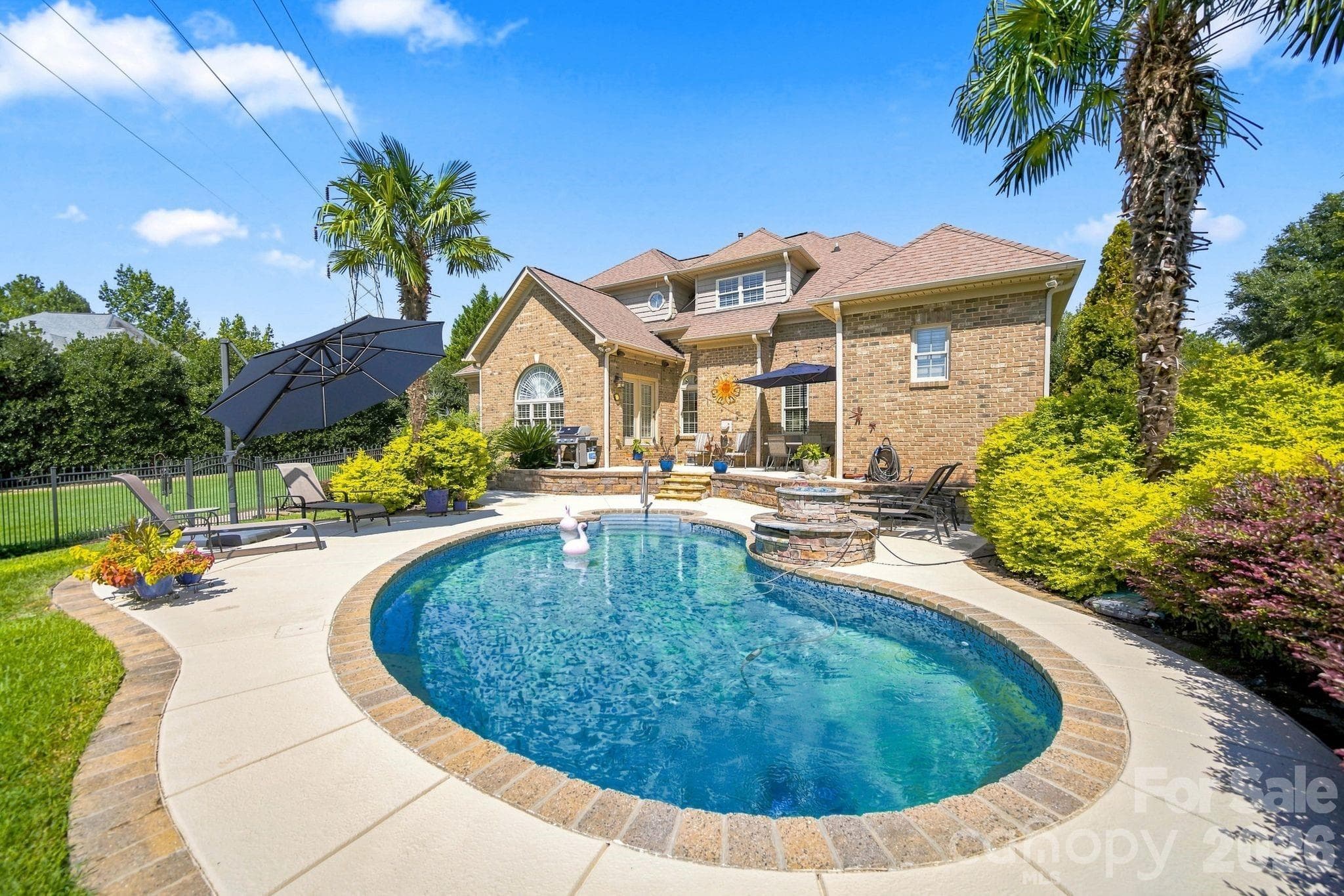 Experience total privacy in your backyard with our beautifully mature and lush landscaping, designed to create a serene oasis. - 1001 Heritage Acres Drive, Weddington