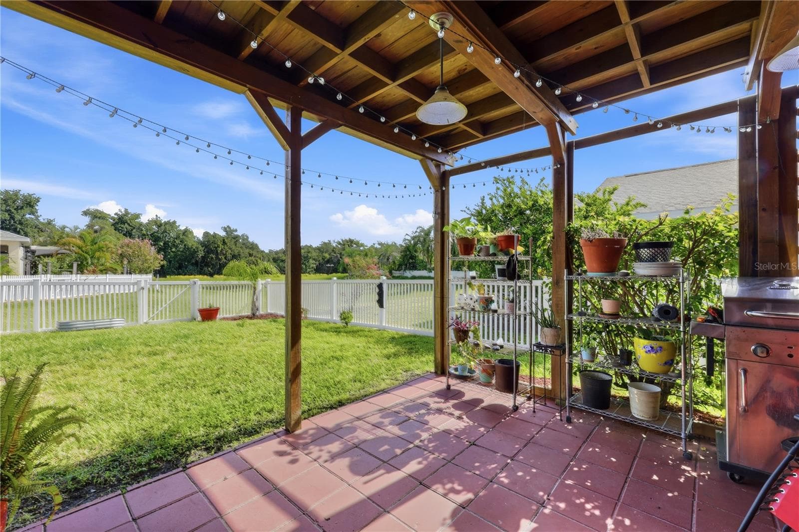 Lovely Covered Terrace with view of the lake and fenced yard - 5310 72ND ST E, PALMETTO