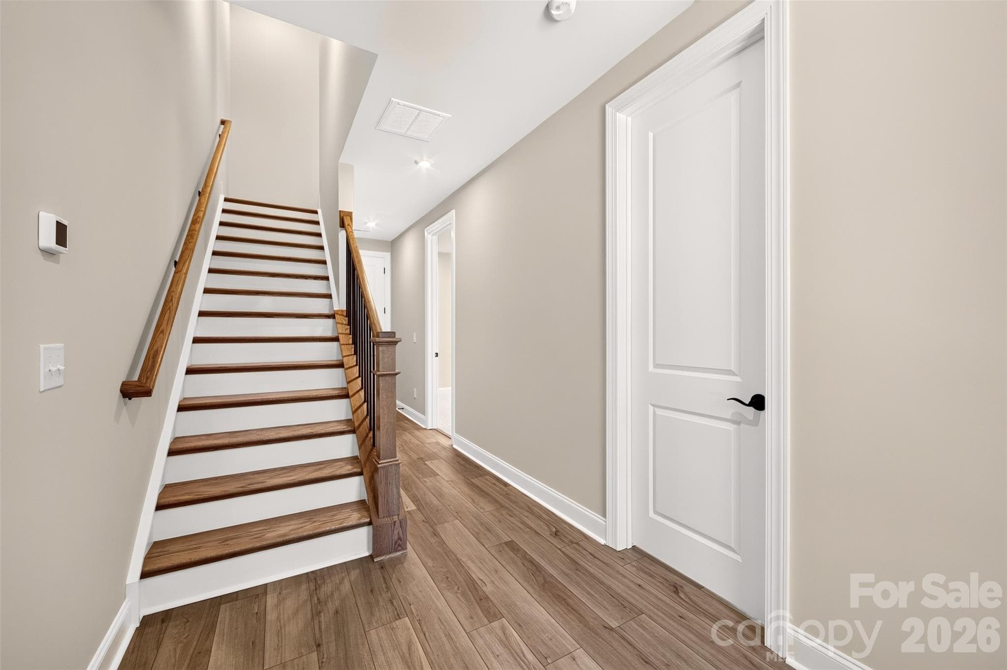 Oak box stairs with open rails - 6012 Yellow Buckeye Drive, Charlotte