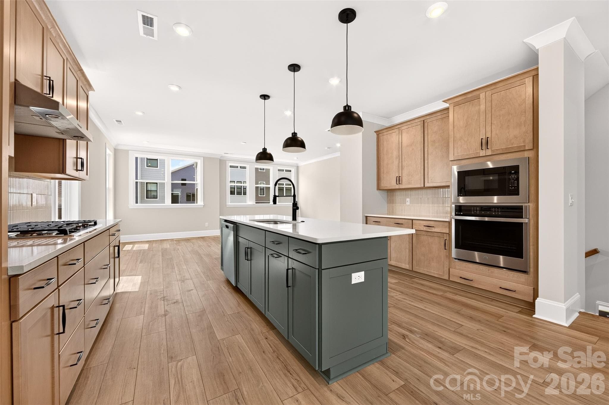 Large kitchen island with single bowl stainless steel sink and storage - 6012 Yellow Buckeye Drive, Charlotte