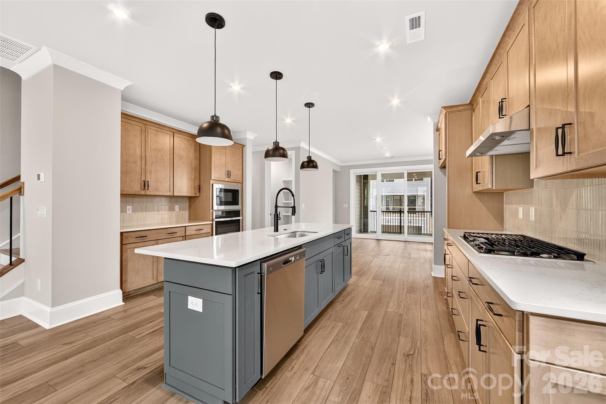 Gourmet kitchen with gas cooktop - 6012 Yellow Buckeye Drive, Charlotte