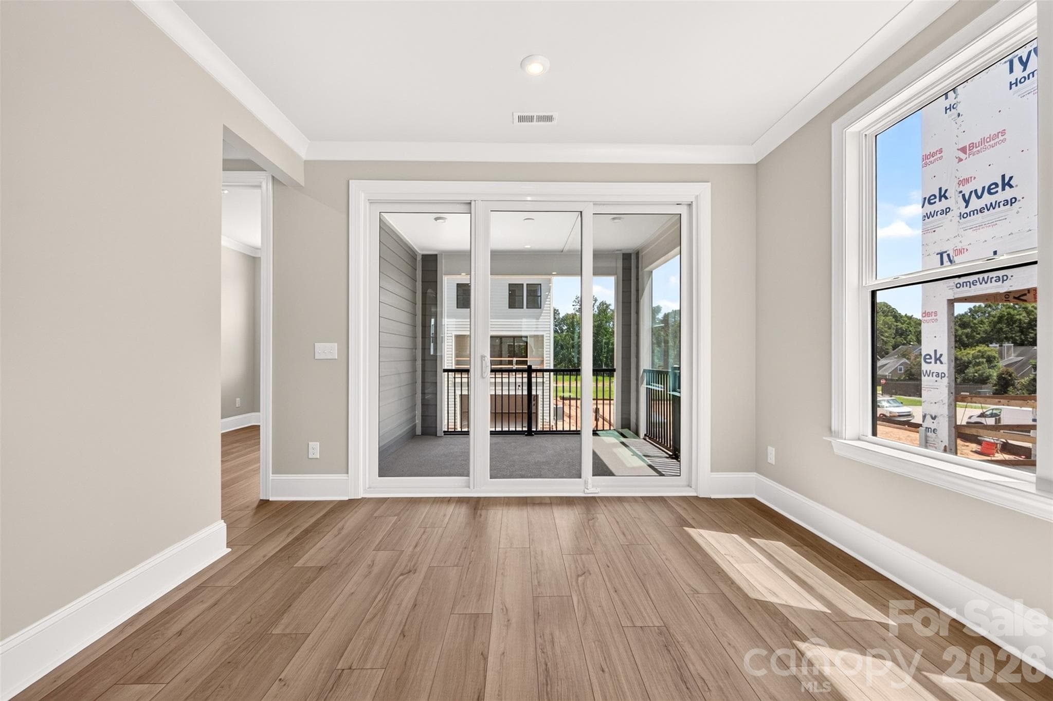 Light filled dining space with access to the second floor office and covered outdoor living - 6012 Yellow Buckeye Drive, Charlotte
