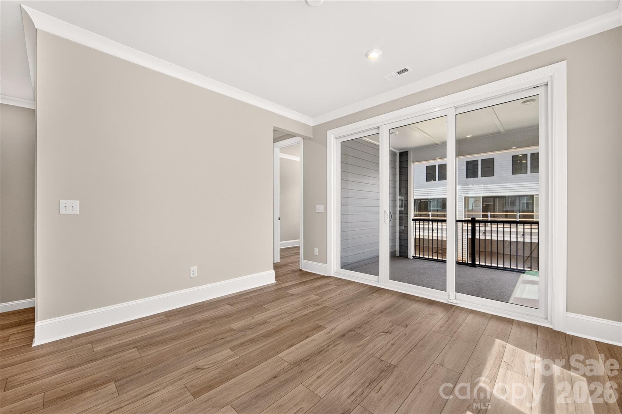 Light filled dining space with access to the second floor office and covered outdoor living - 6012 Yellow Buckeye Drive, Charlotte