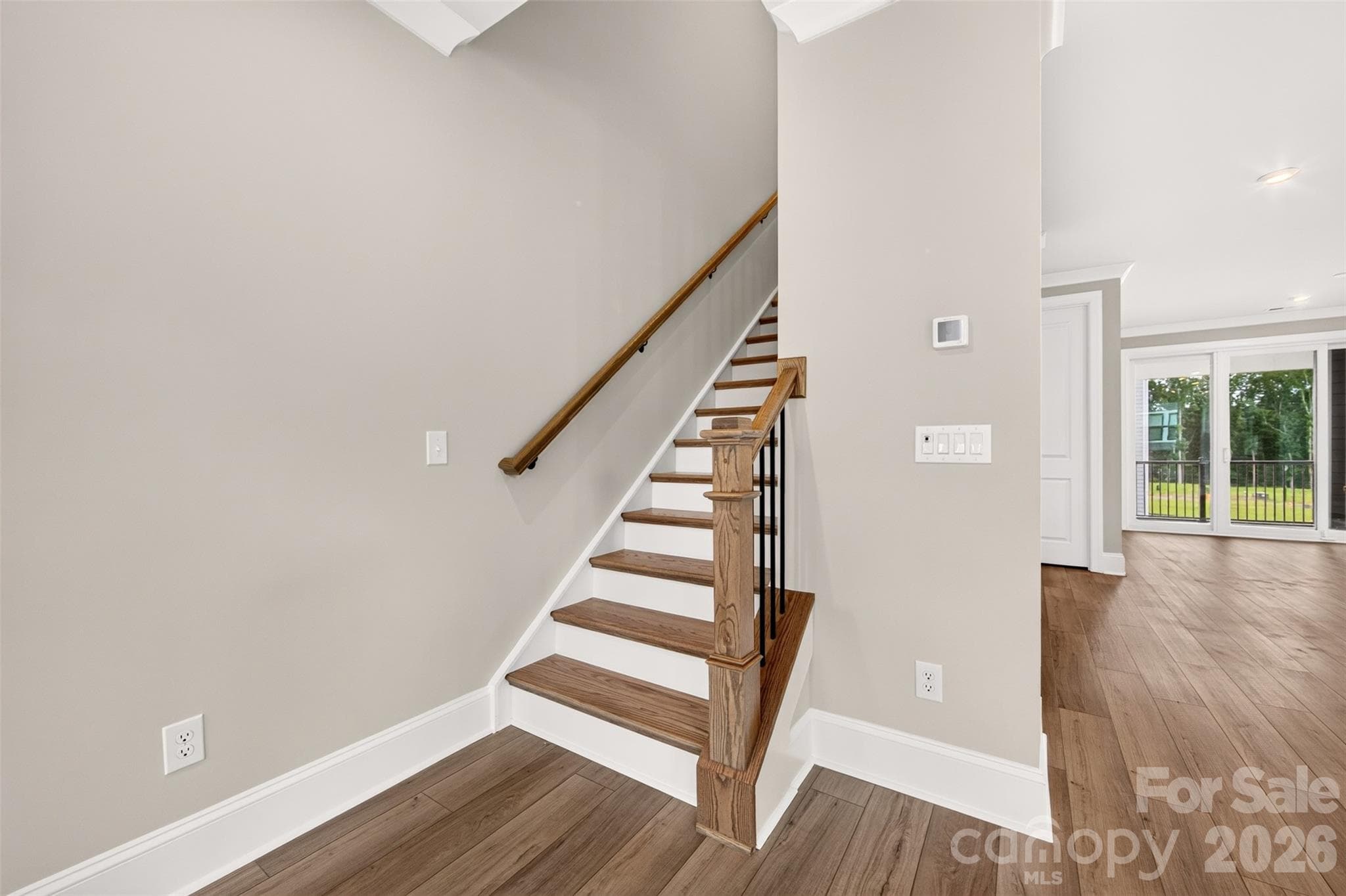 second floor oak box stairs with open rails - 6012 Yellow Buckeye Drive, Charlotte