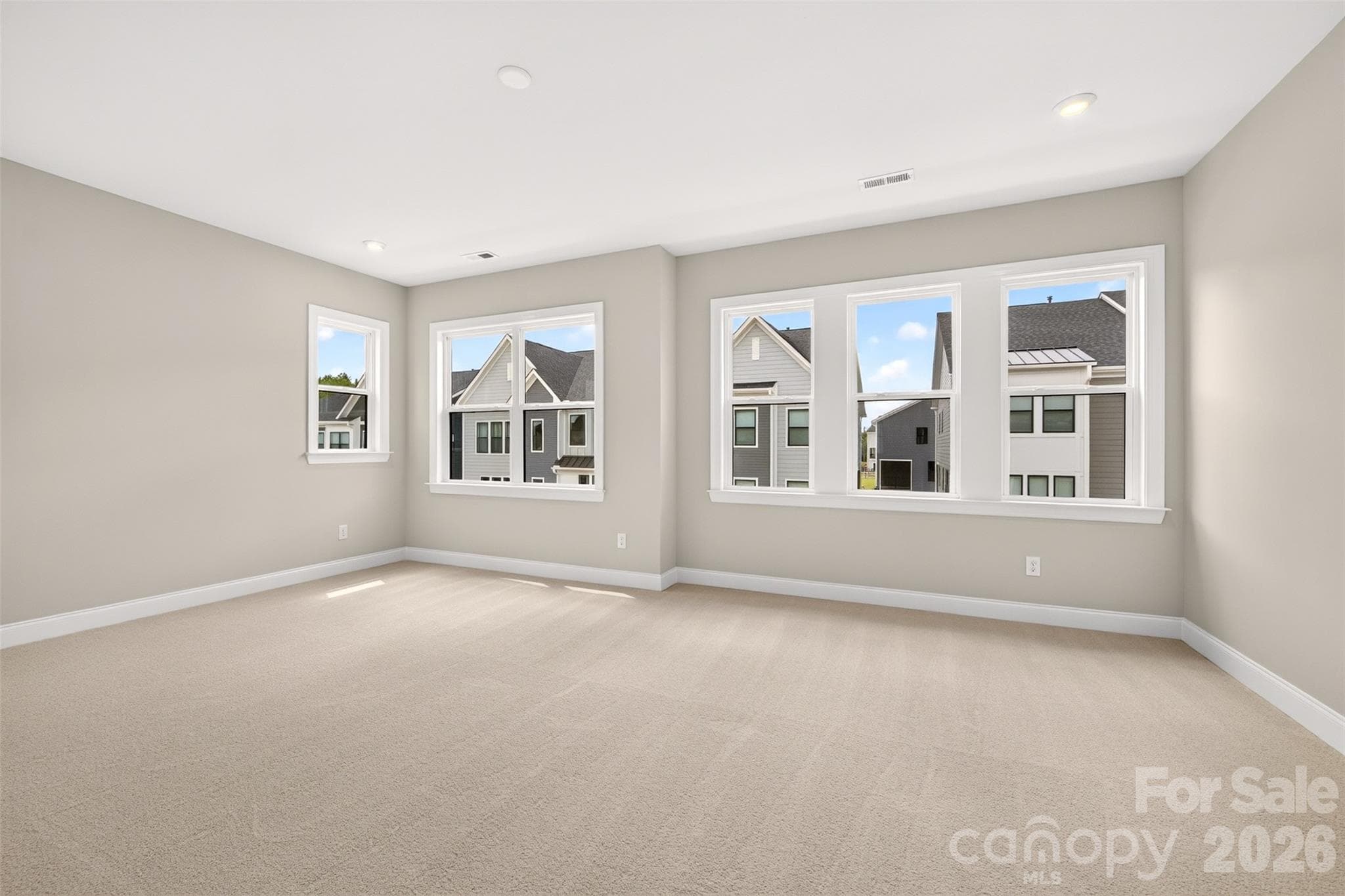 light filled primary bedroom - 6012 Yellow Buckeye Drive, Charlotte