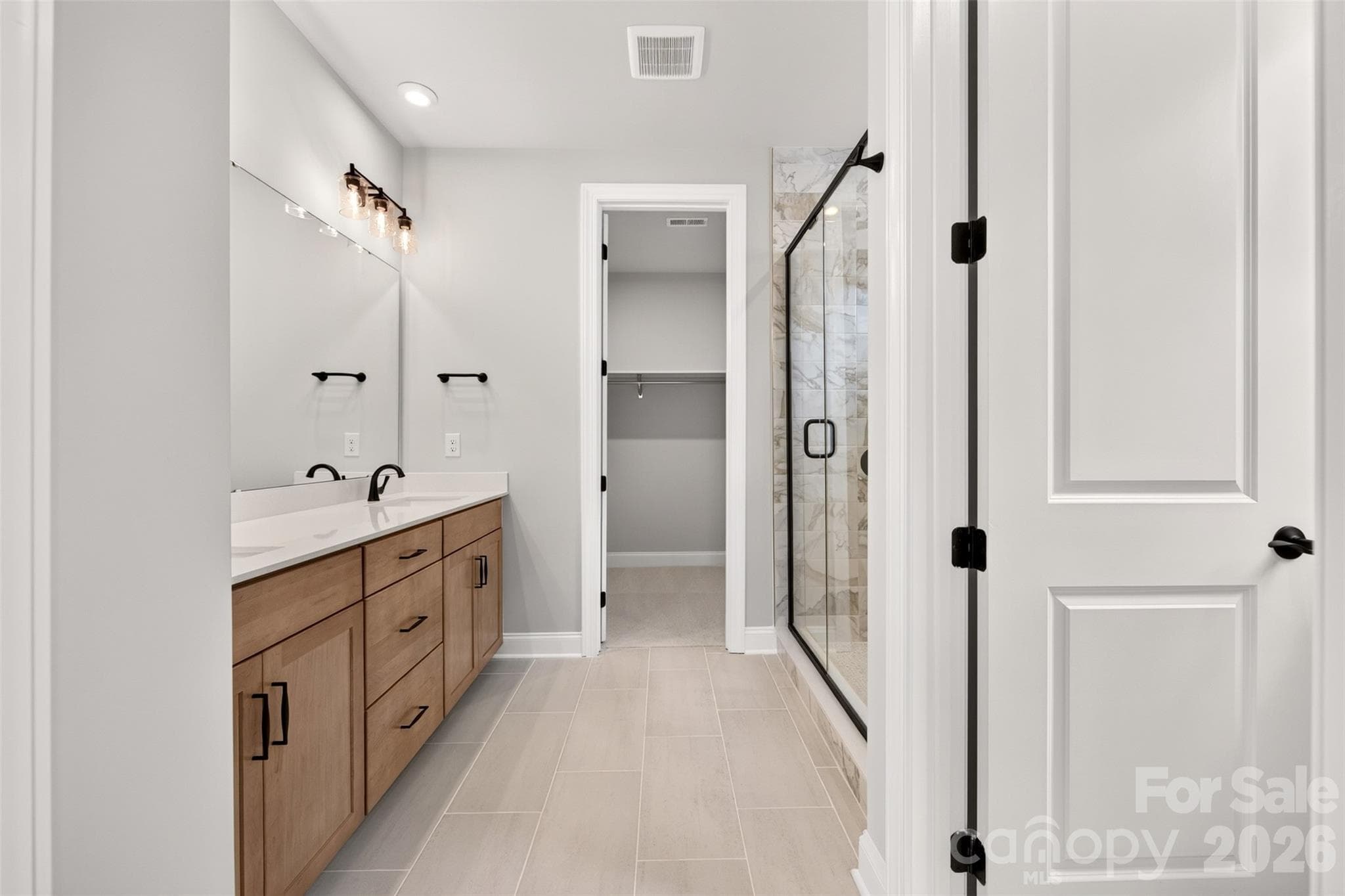 Dual vanity primary bathroom - 6012 Yellow Buckeye Drive, Charlotte