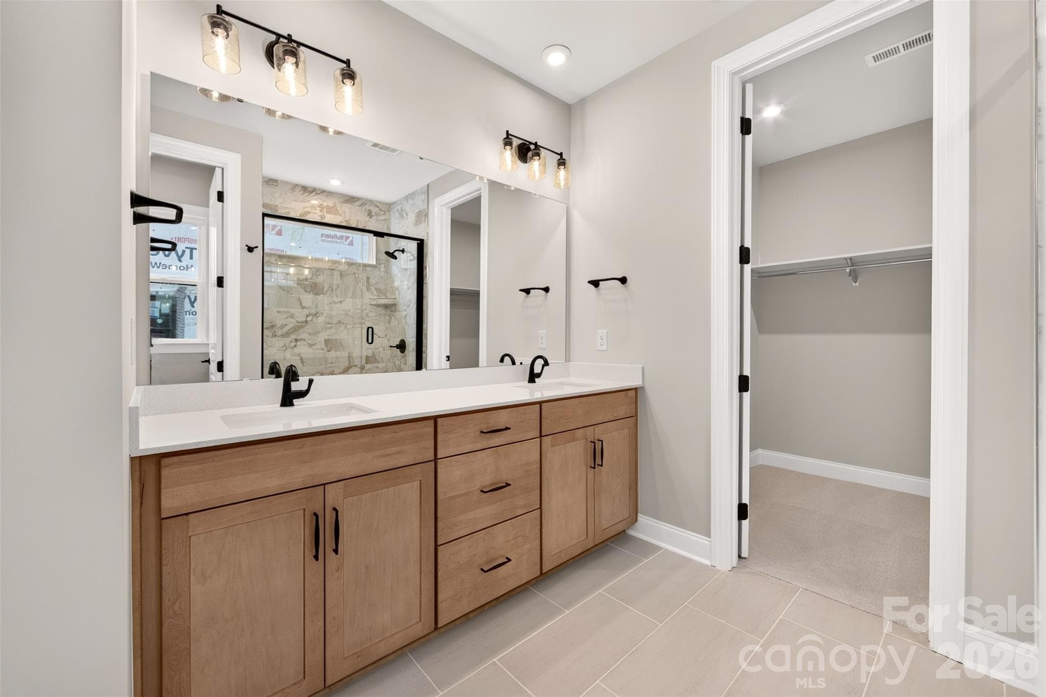 Dual vanity primary bathroom - 6012 Yellow Buckeye Drive, Charlotte