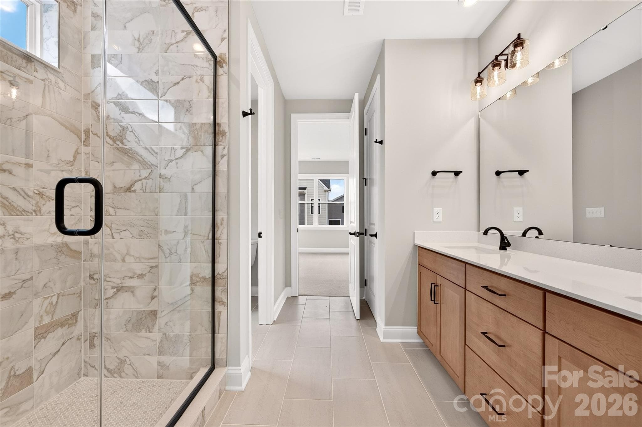 Primary bathroom with tiled walk-in shower - 6012 Yellow Buckeye Drive, Charlotte