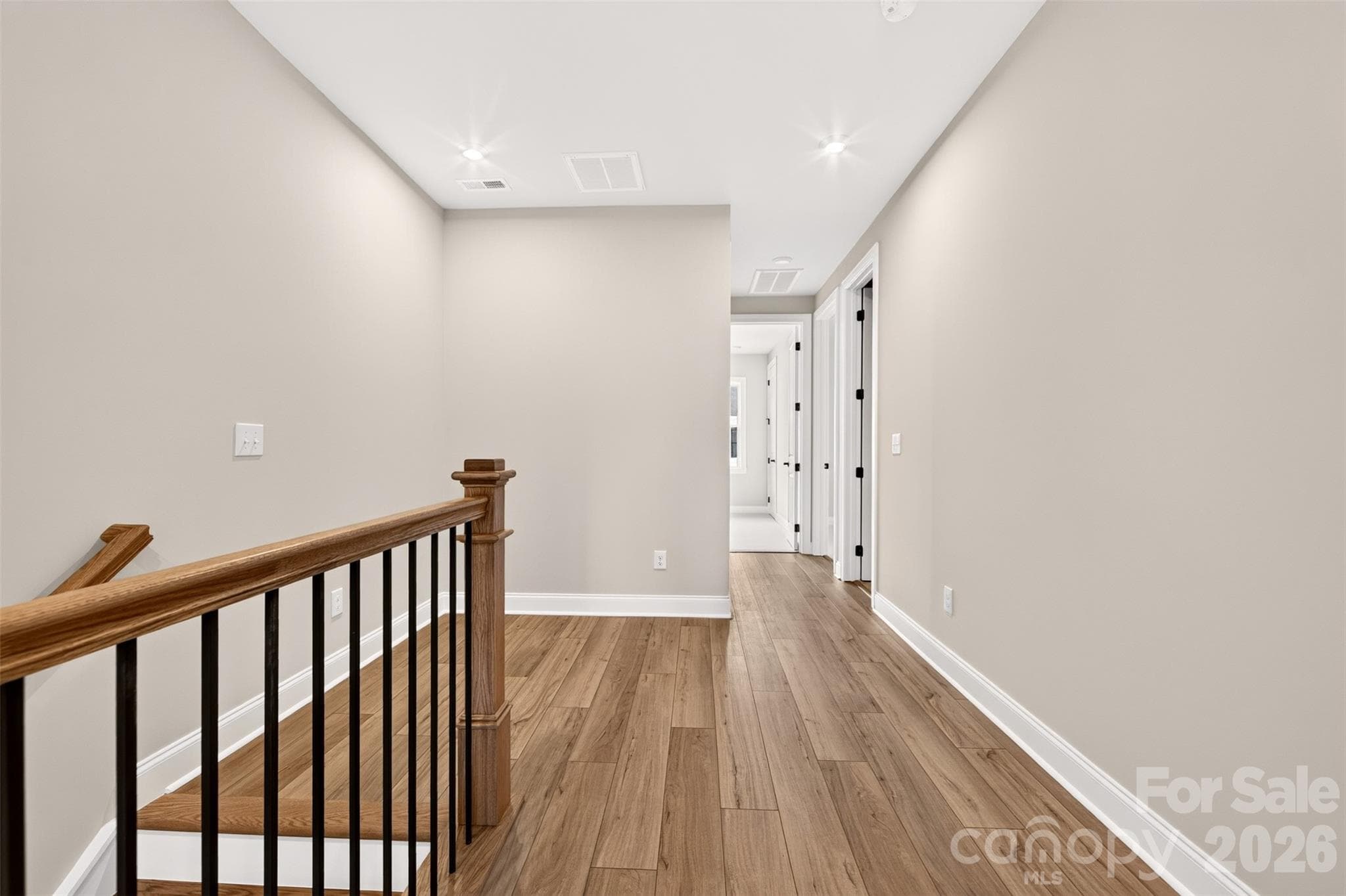 Third floor hallway with open rails - 6012 Yellow Buckeye Drive, Charlotte