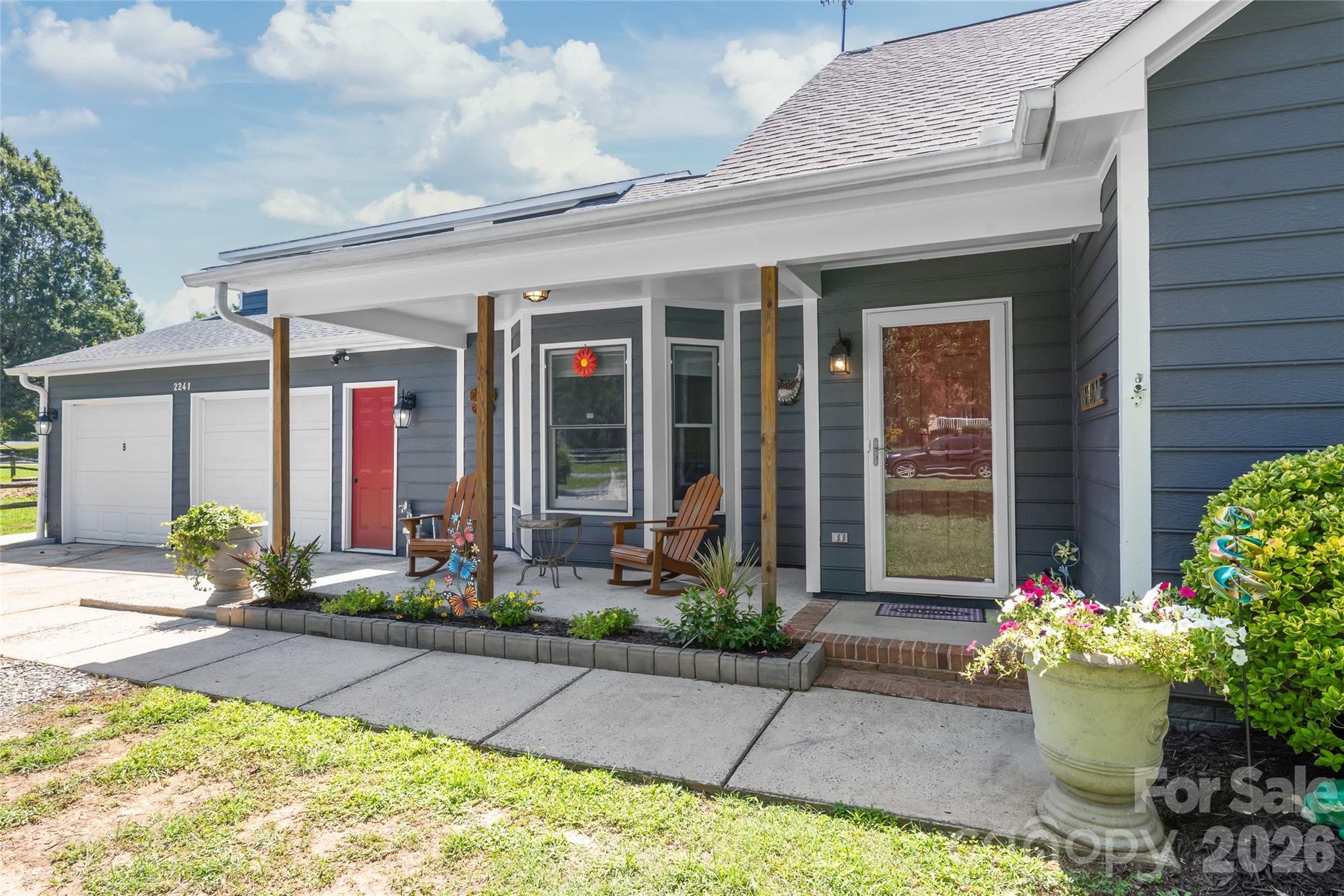 Enjoy a cup of coffee with a friend on the covered front porch - 2241 Indian Cross Trail, Matthews