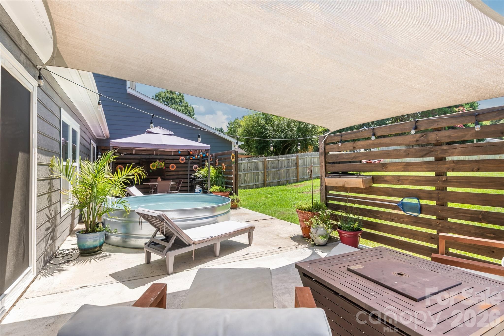 Sunsail covered patio area off of Main home Primary bedroom - 2241 Indian Cross Trail, Matthews