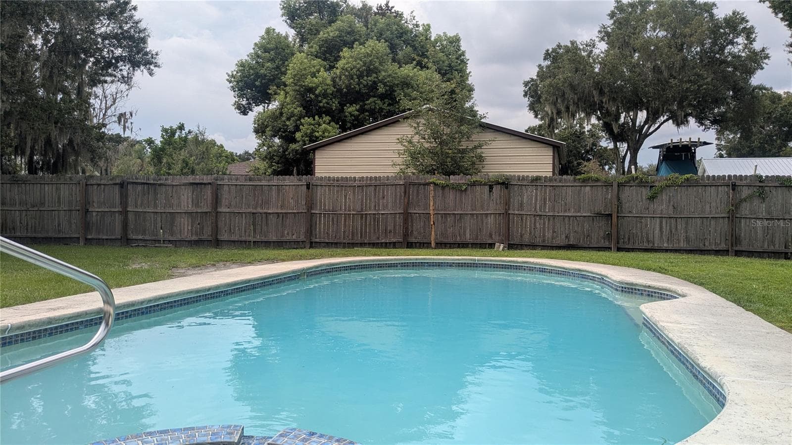Deep pool in large backyard - 5045 MISTY LAKE DR, MULBERRY