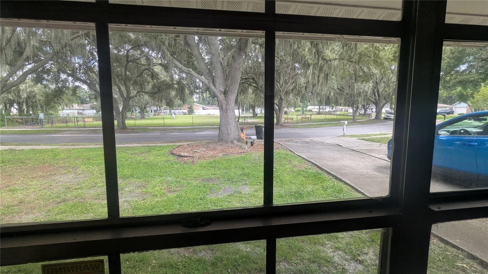 View of Misty Lake Park, including playground, from living room - 5045 MISTY LAKE DR, MULBERRY