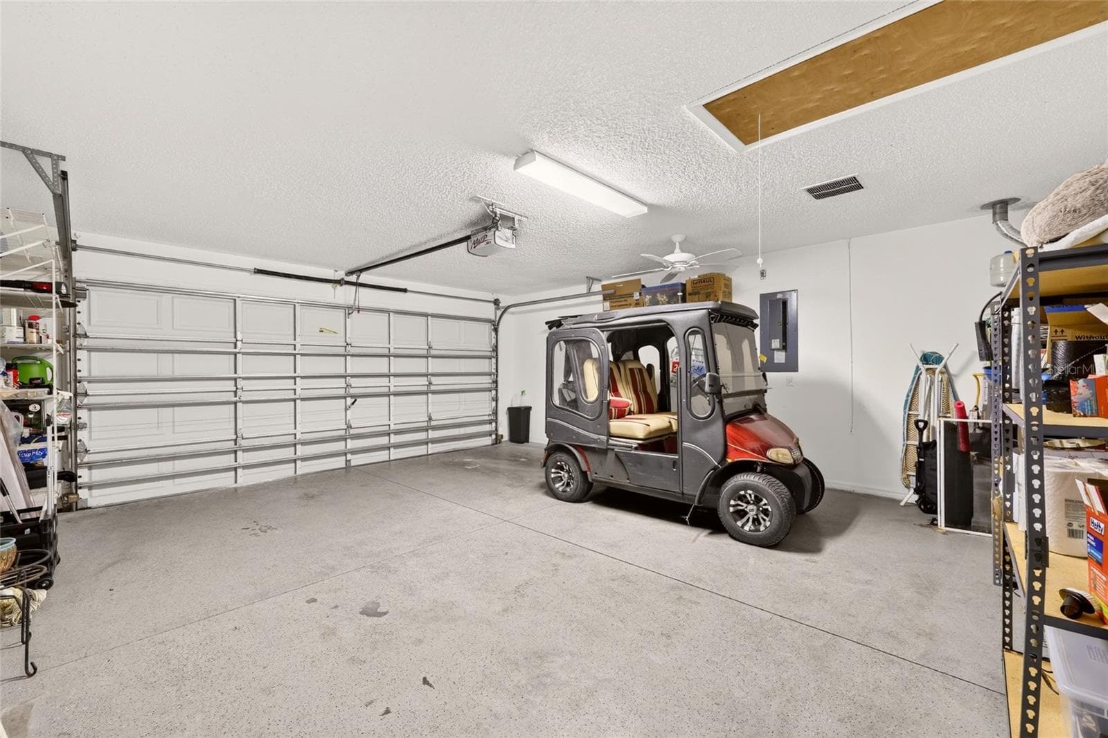 2-Car Garage (Golf Cart does not CONVEY) - 16947 SE 93RD CUTHBERT CIR, THE VILLAGES